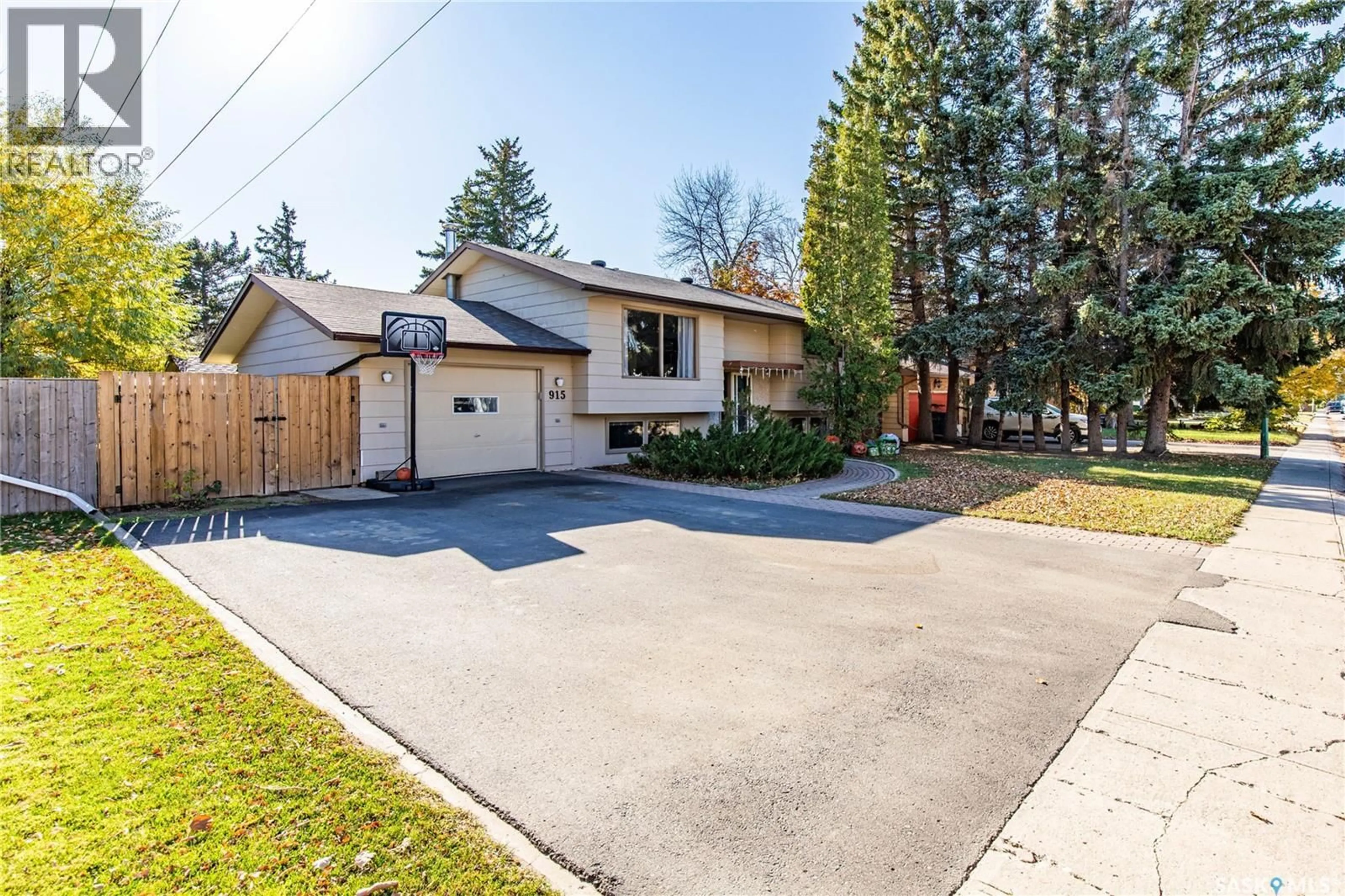 A pic from outside/outdoor area/front of a property/back of a property/a pic from drone, street for 915 NORMANDY DRIVE, Moose Jaw Saskatchewan S6H3G8
