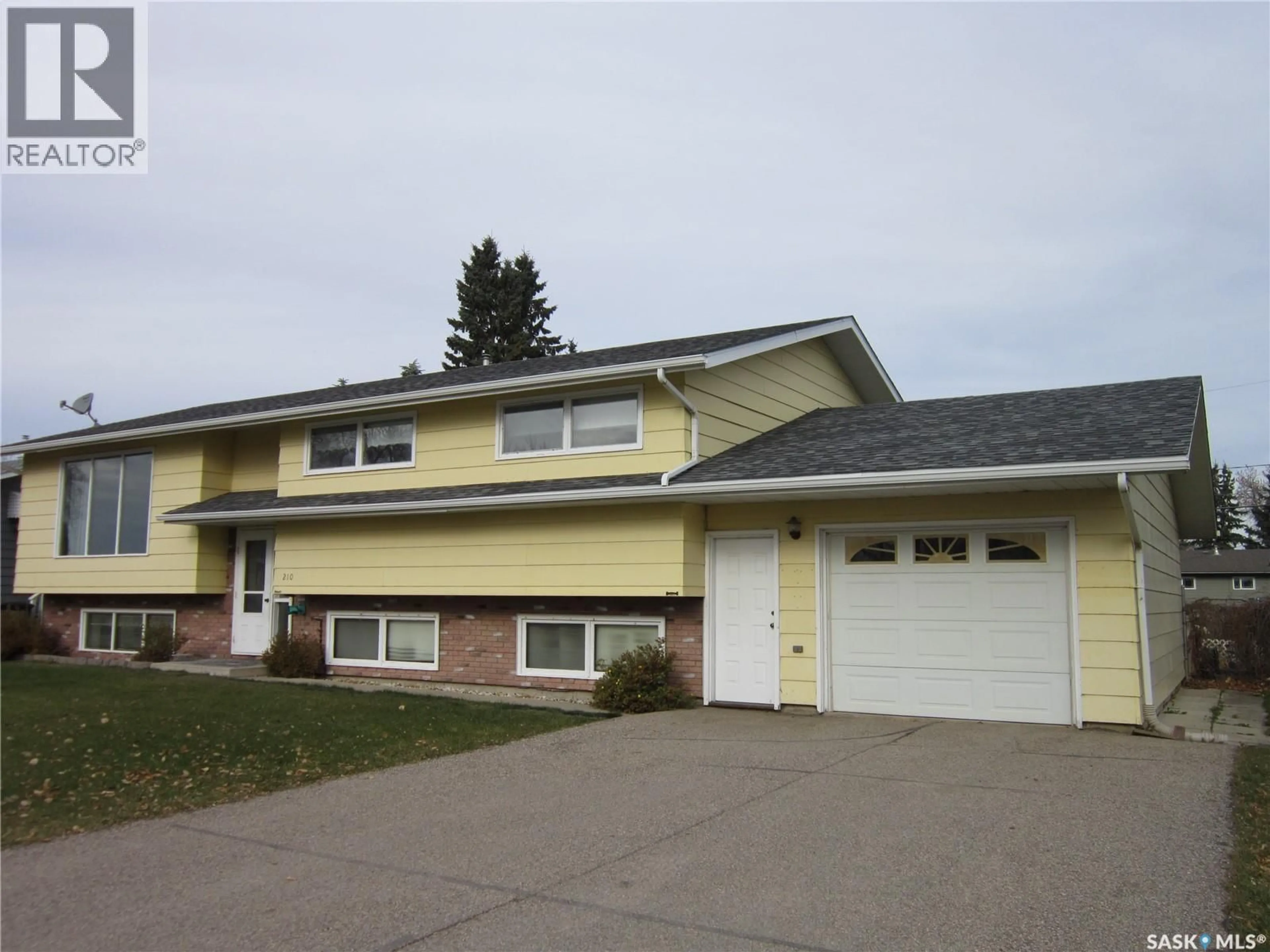 Home with vinyl exterior material, street for 210 1ST STREET, Wakaw Saskatchewan S0K4P0