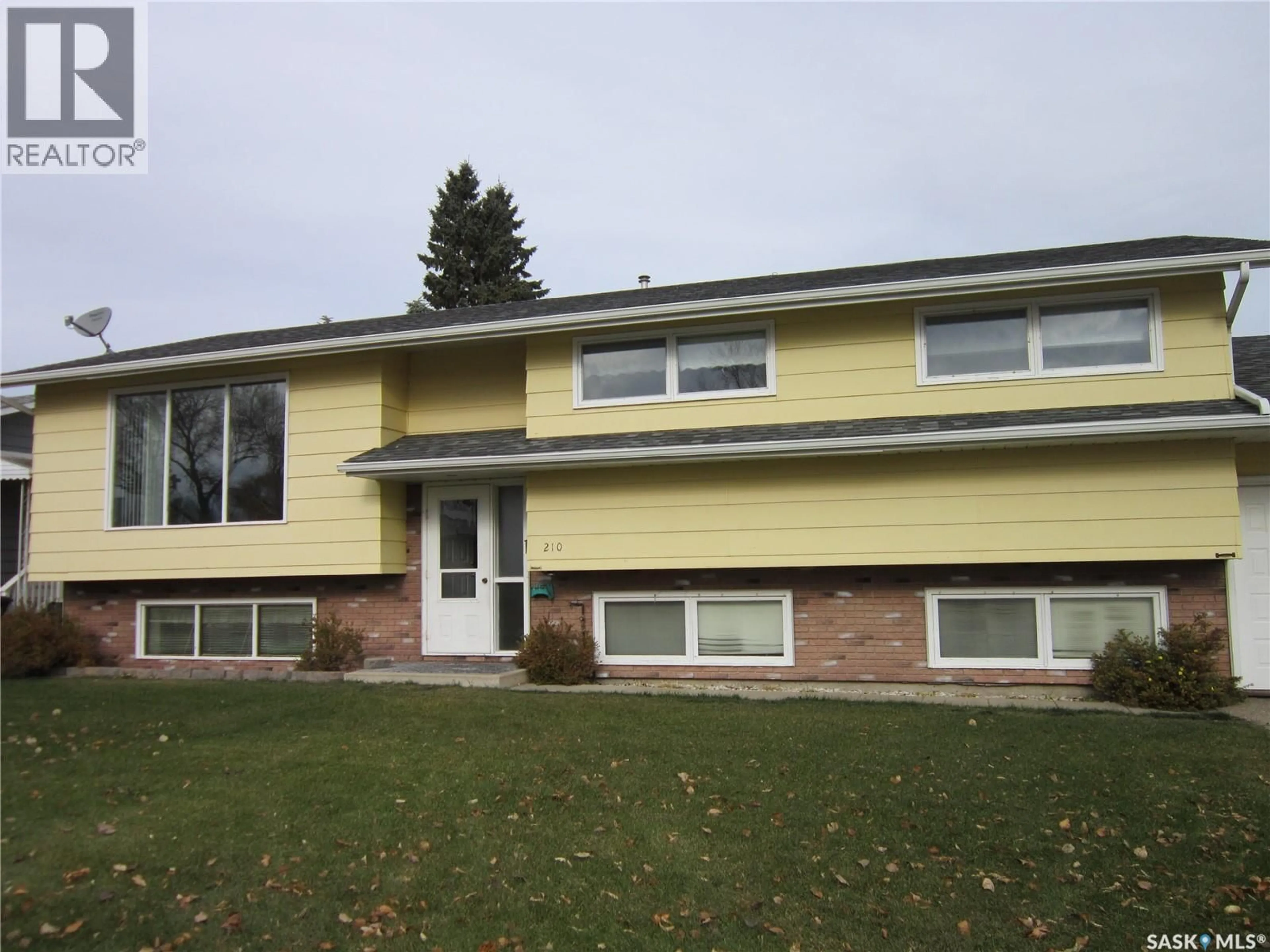Home with vinyl exterior material, street for 210 1ST STREET, Wakaw Saskatchewan S0K4P0