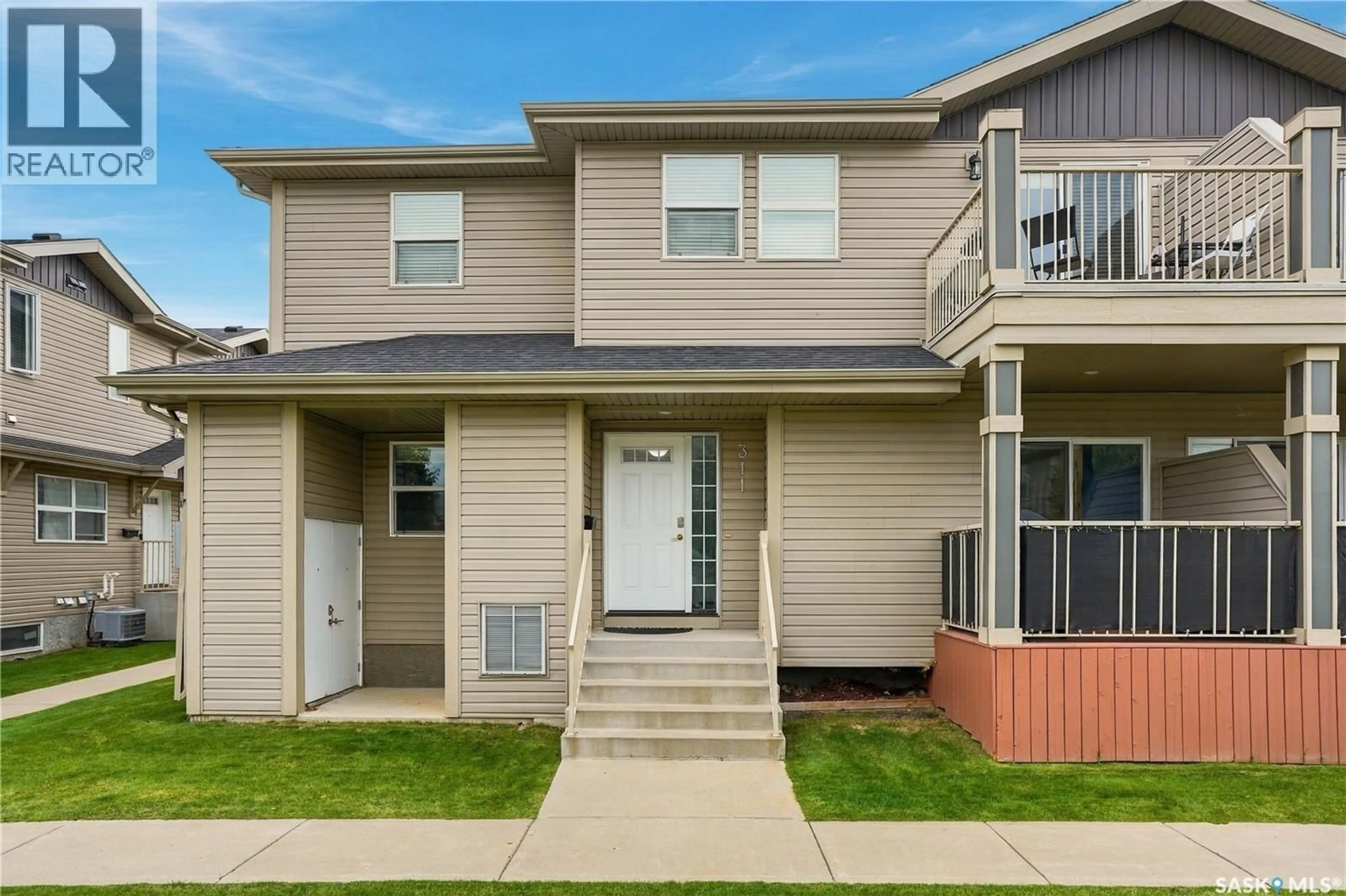 Home with vinyl exterior material, street for 311 100 CHAPARRAL BOULEVARD, Martensville Saskatchewan S0K0A2