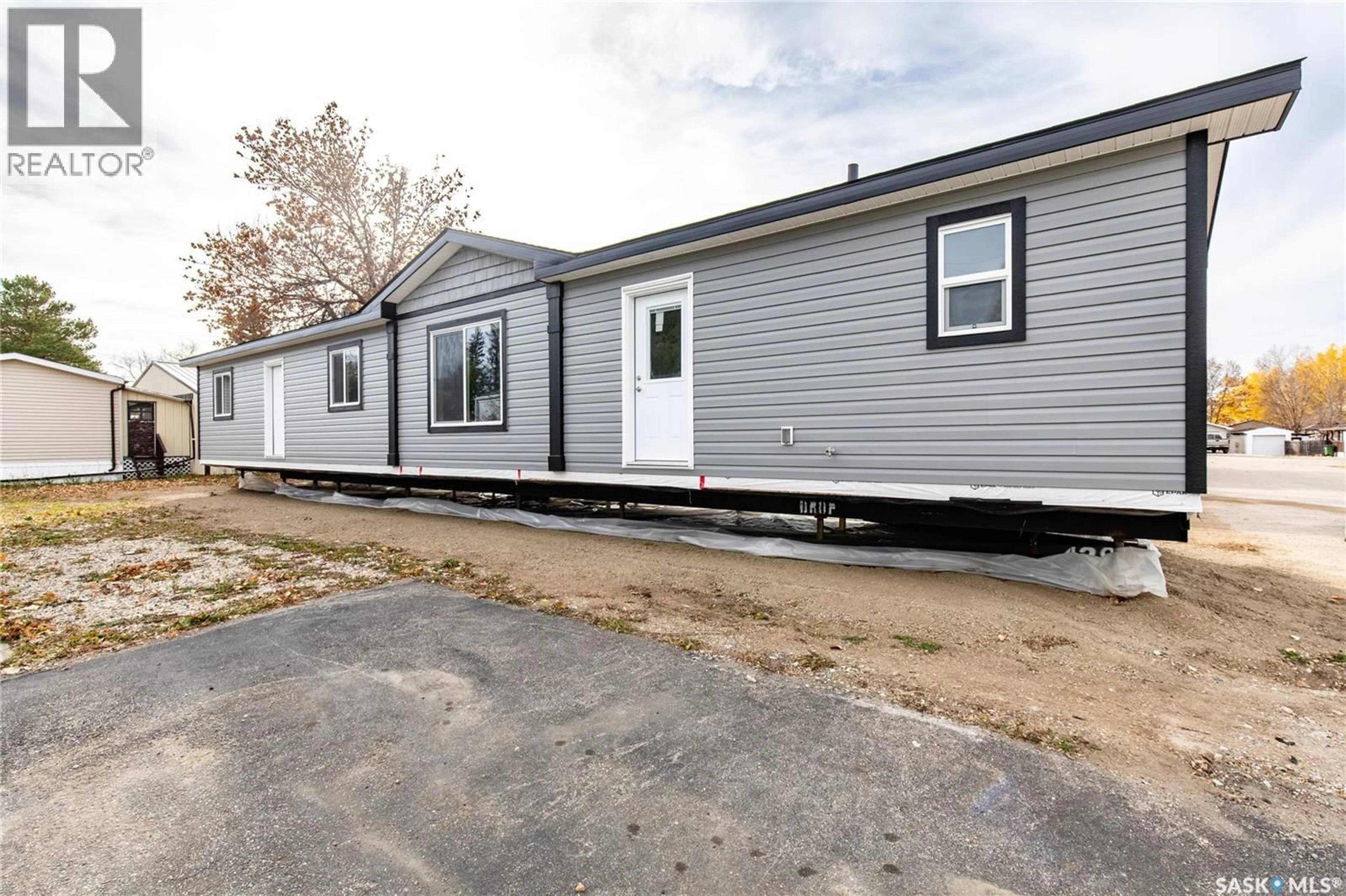 Home with vinyl exterior material, street for E19 - 1455 9TH AVENUE, Moose Jaw Saskatchewan S6J1C6