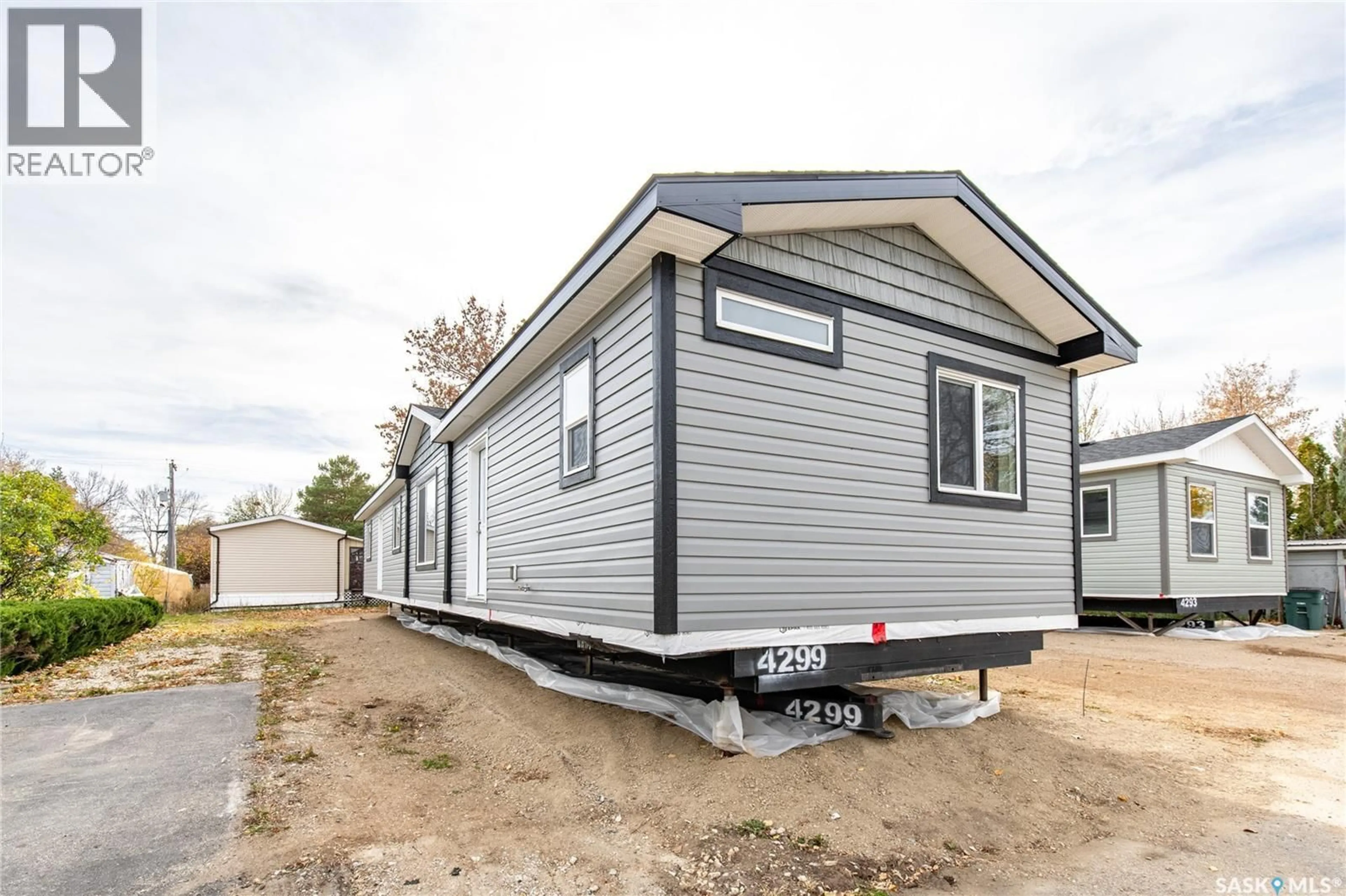 Home with vinyl exterior material, street for E19 - 1455 9TH AVENUE, Moose Jaw Saskatchewan S6J1C6