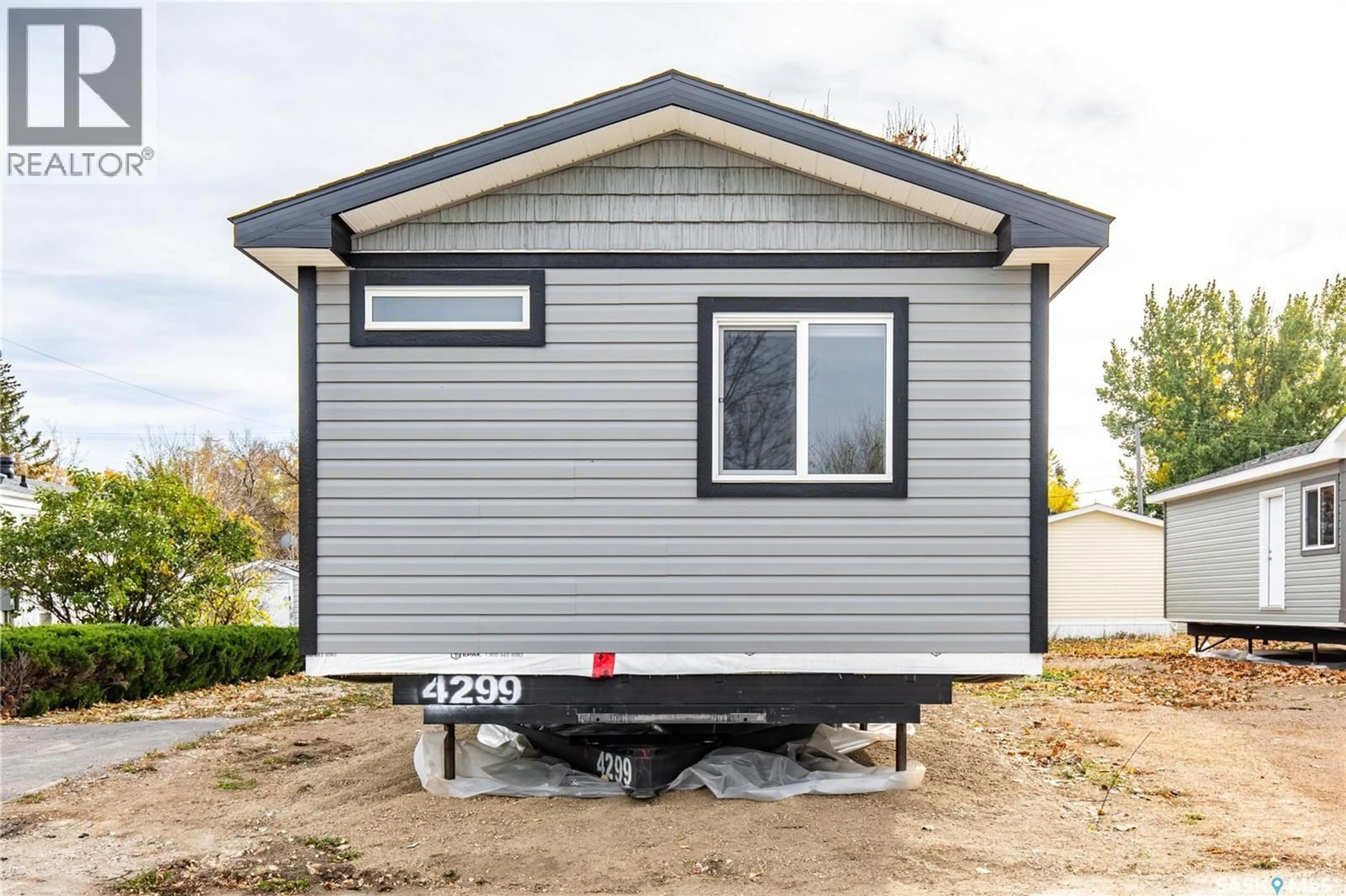 Home with vinyl exterior material, street for E19 - 1455 9TH AVENUE, Moose Jaw Saskatchewan S6J1C6