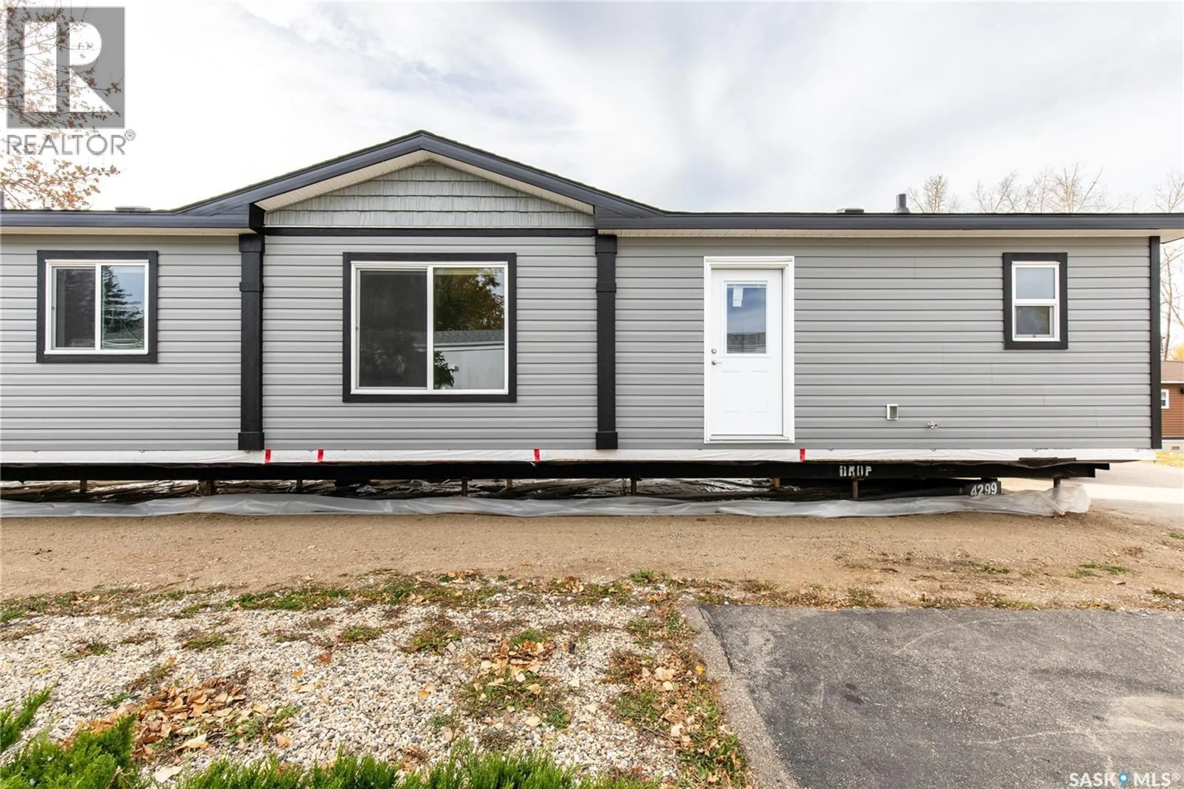 Home with vinyl exterior material, street for E19 - 1455 9TH AVENUE, Moose Jaw Saskatchewan S6J1C6