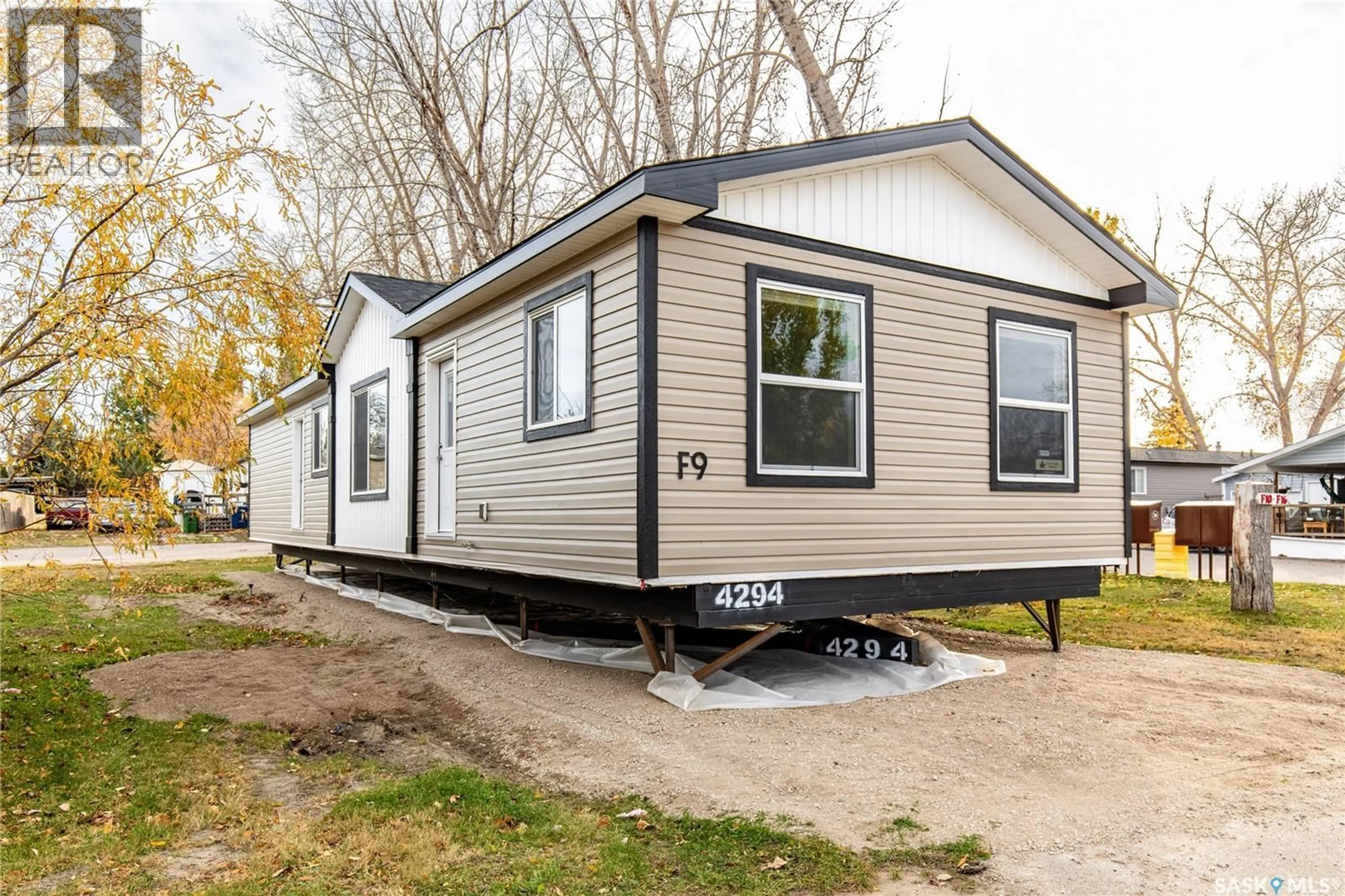 Home with vinyl exterior material, street for F9 - 1455 9TH AVENUE, Moose Jaw Saskatchewan S6J1C6