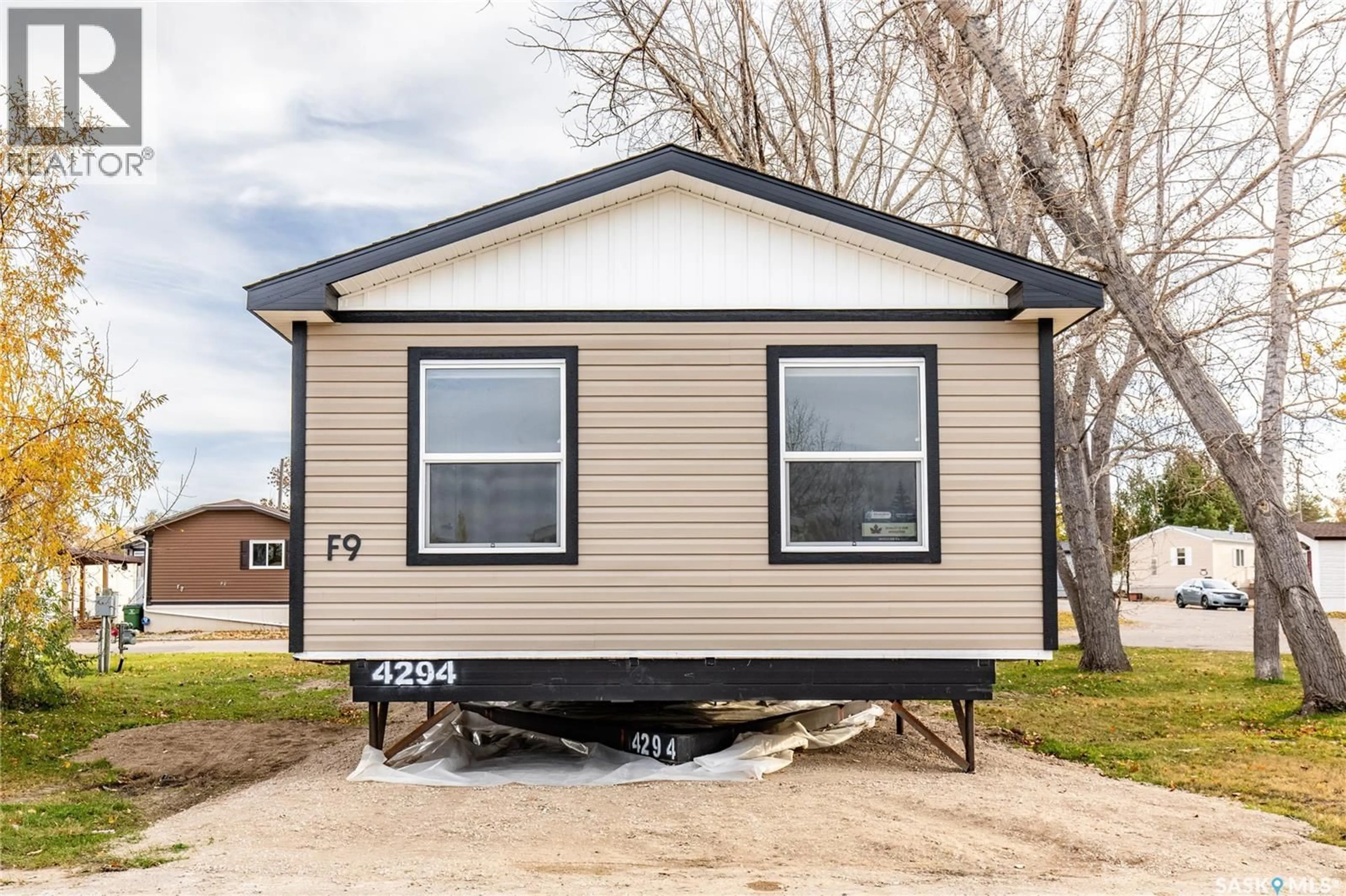 Home with vinyl exterior material, street for F9 - 1455 9TH AVENUE, Moose Jaw Saskatchewan S6J1C6