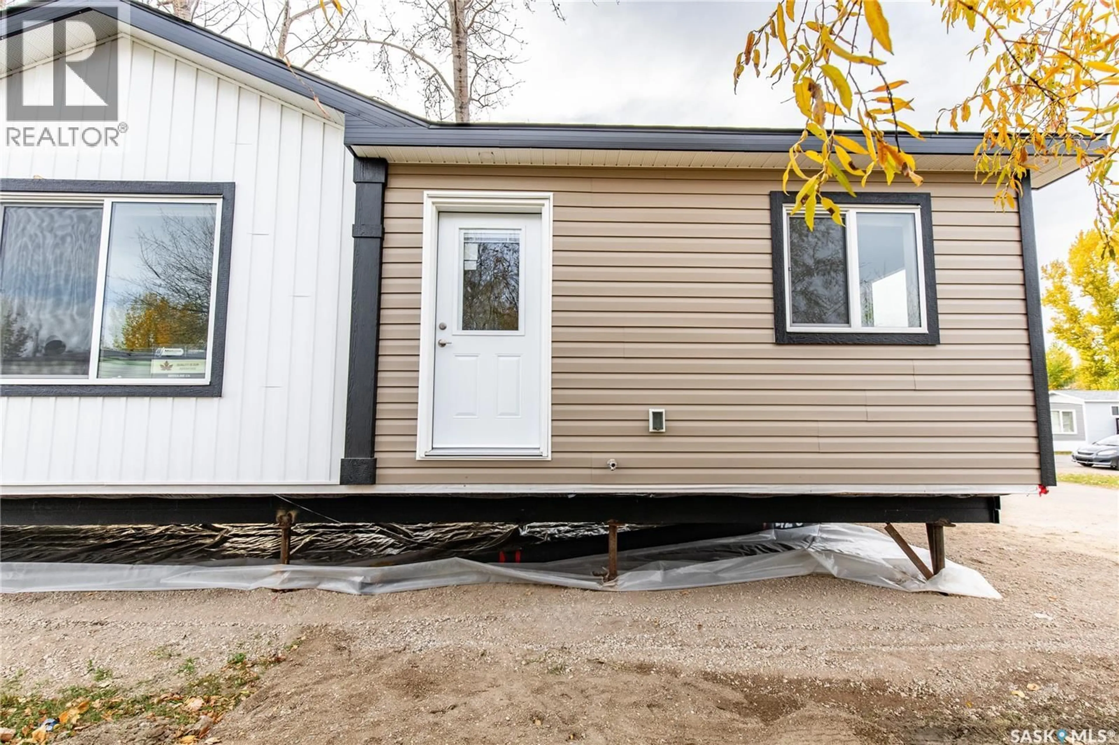 Home with vinyl exterior material, street for F9 - 1455 9TH AVENUE, Moose Jaw Saskatchewan S6J1C6