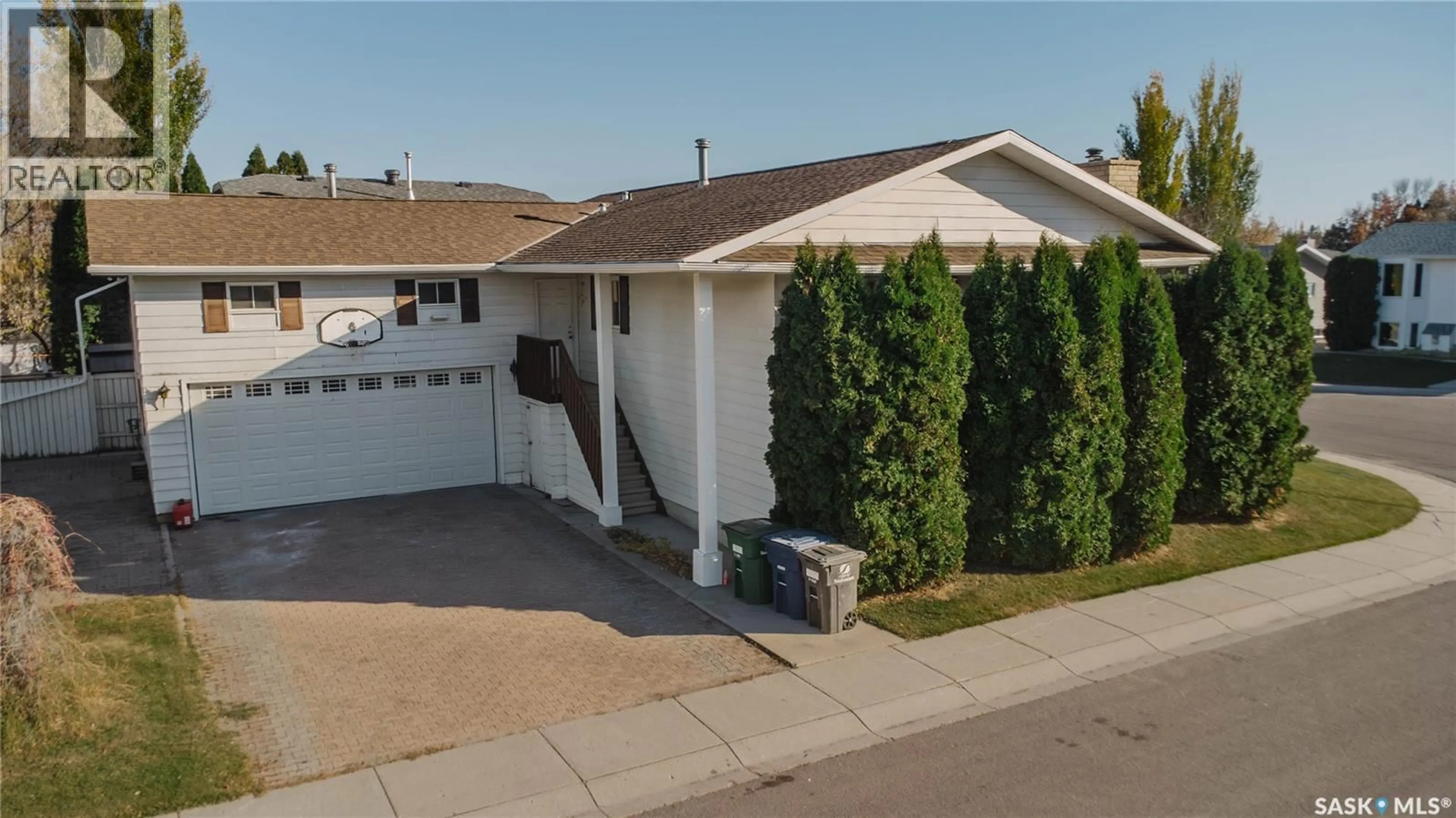 Home with vinyl exterior material, street for 303 STAIGH CRESCENT, Saskatoon Saskatchewan S7N3T5
