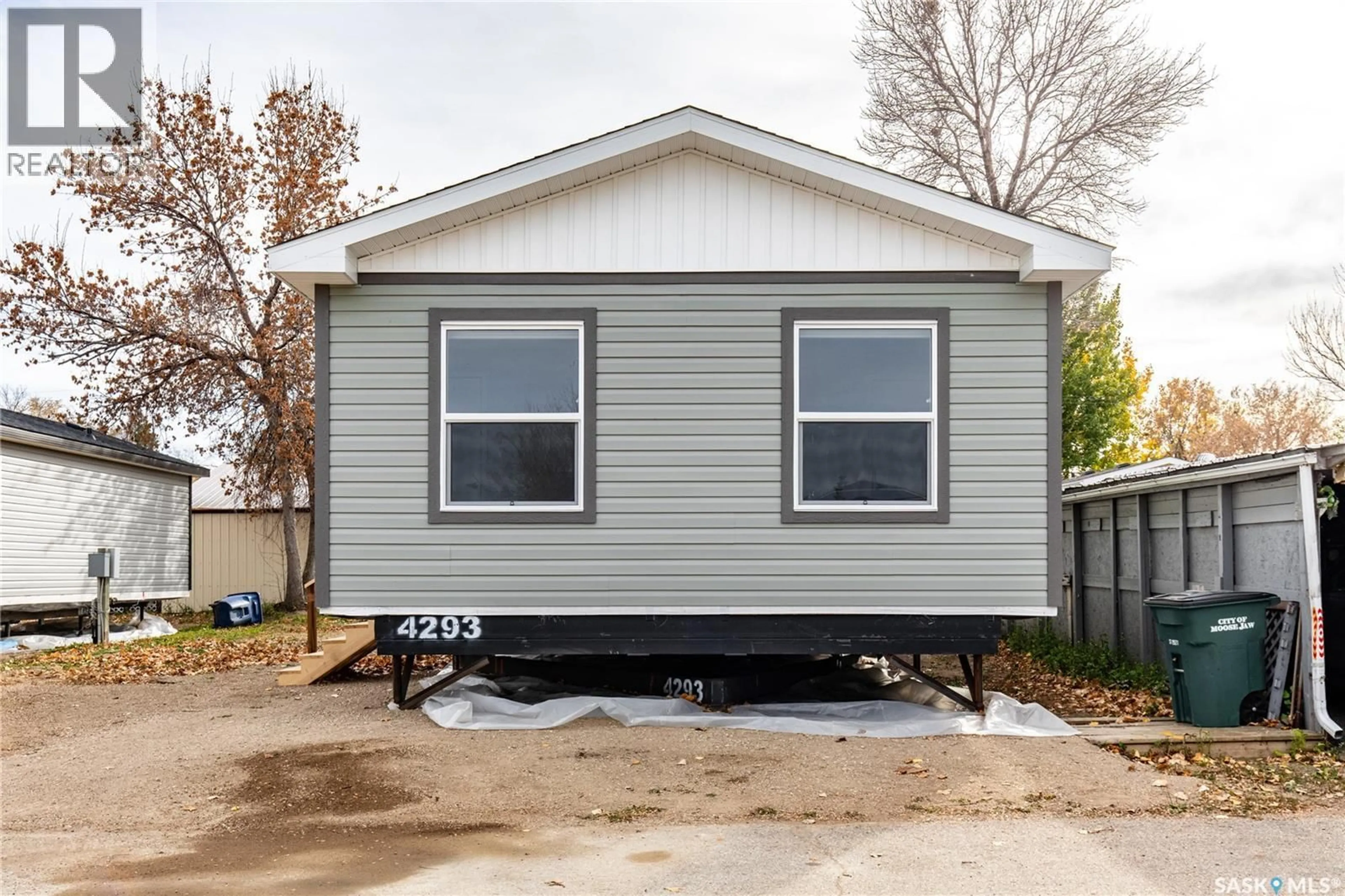Home with vinyl exterior material, street for E18 - 1455 9TH AVENUE, Moose Jaw Saskatchewan S6J1C6