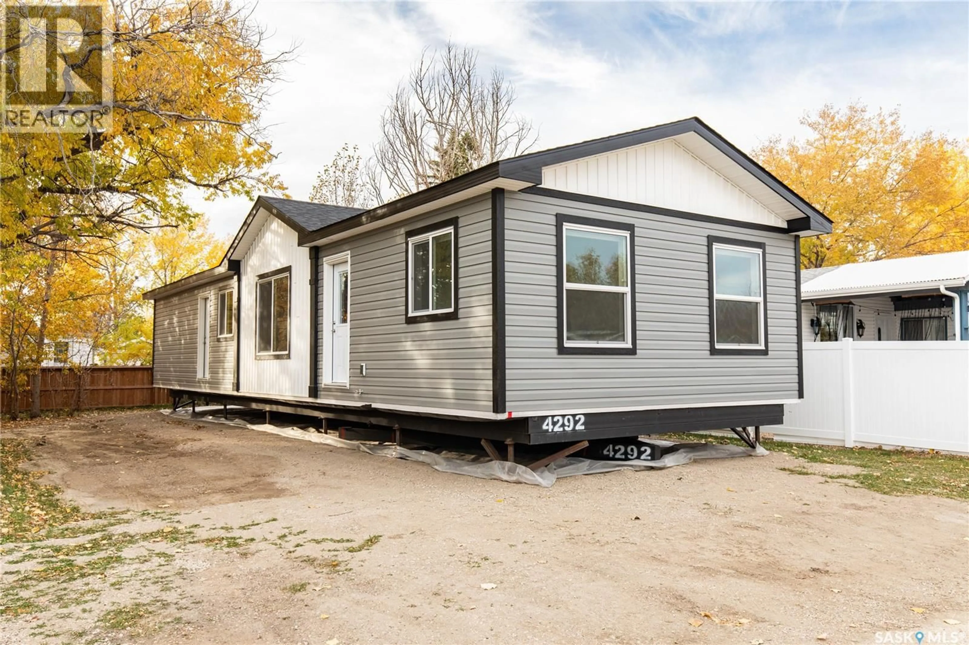 Home with vinyl exterior material, street for D6 - 1455 9TH AVENUE, Moose Jaw Saskatchewan S6J1C6