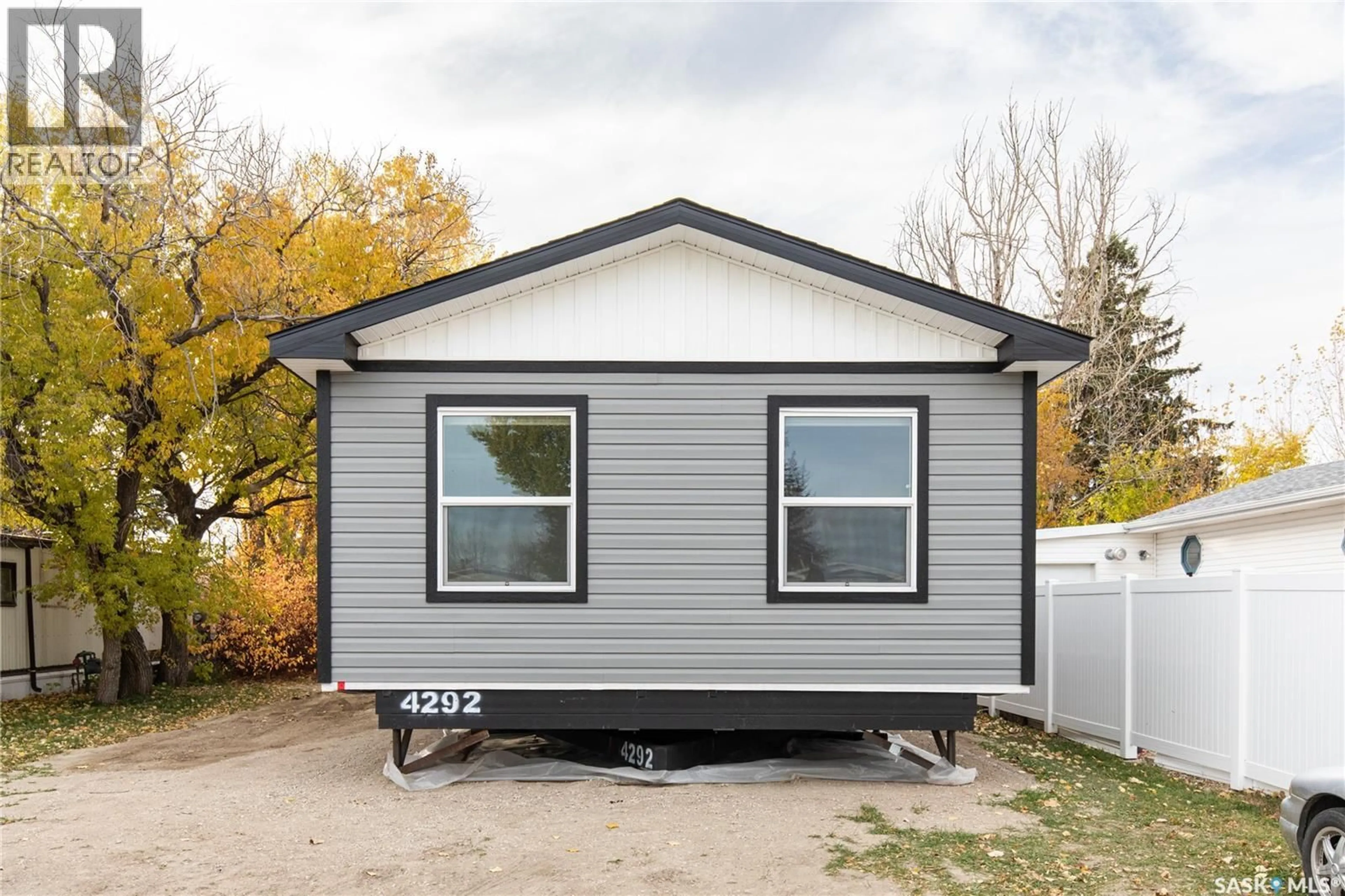 Home with vinyl exterior material, street for D6 - 1455 9TH AVENUE, Moose Jaw Saskatchewan S6J1C6