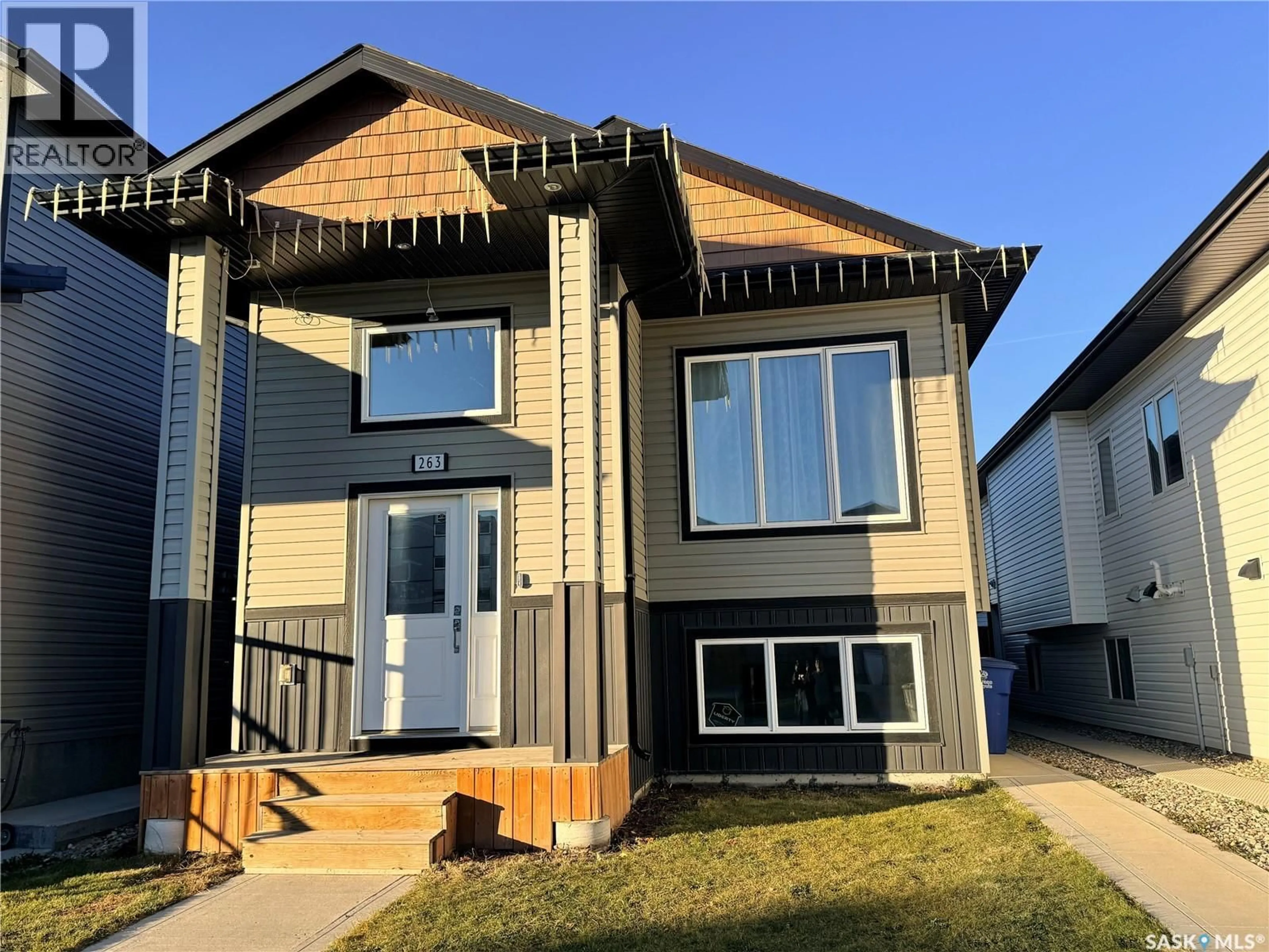 Home with vinyl exterior material, street for 263 THAKUR STREET, Saskatoon Saskatchewan S7W1C5