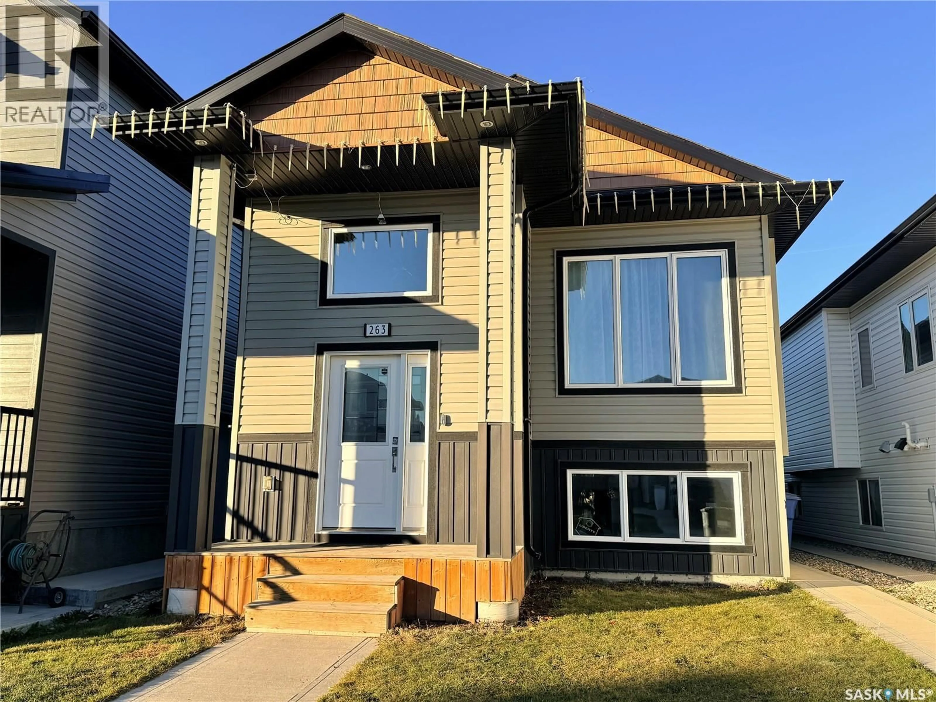 Home with vinyl exterior material, street for 263 THAKUR STREET, Saskatoon Saskatchewan S7W1C5