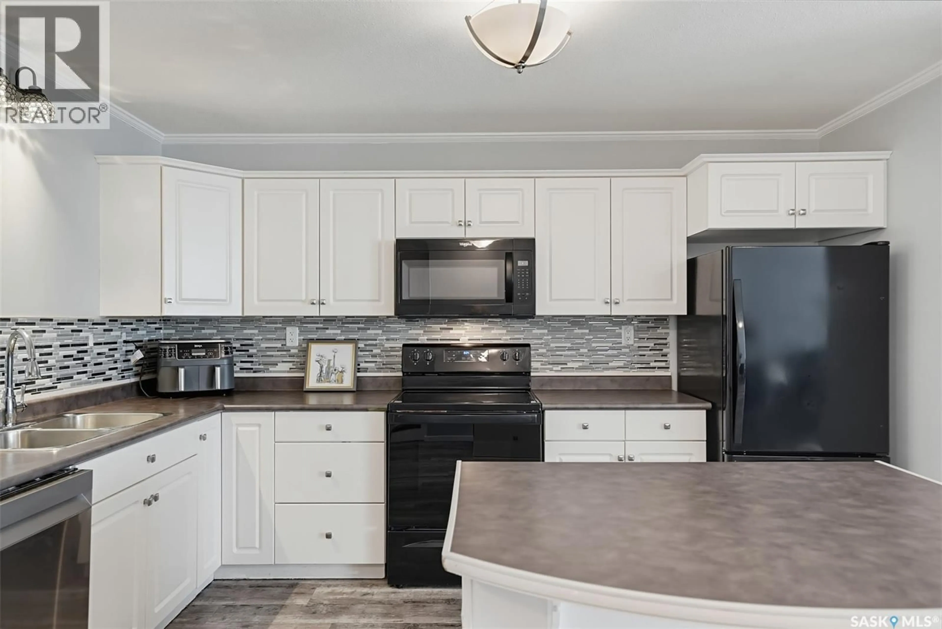 Open concept kitchen, ceramic/tile floor for 904 715 HART ROAD, Saskatoon Saskatchewan S7M3Y8