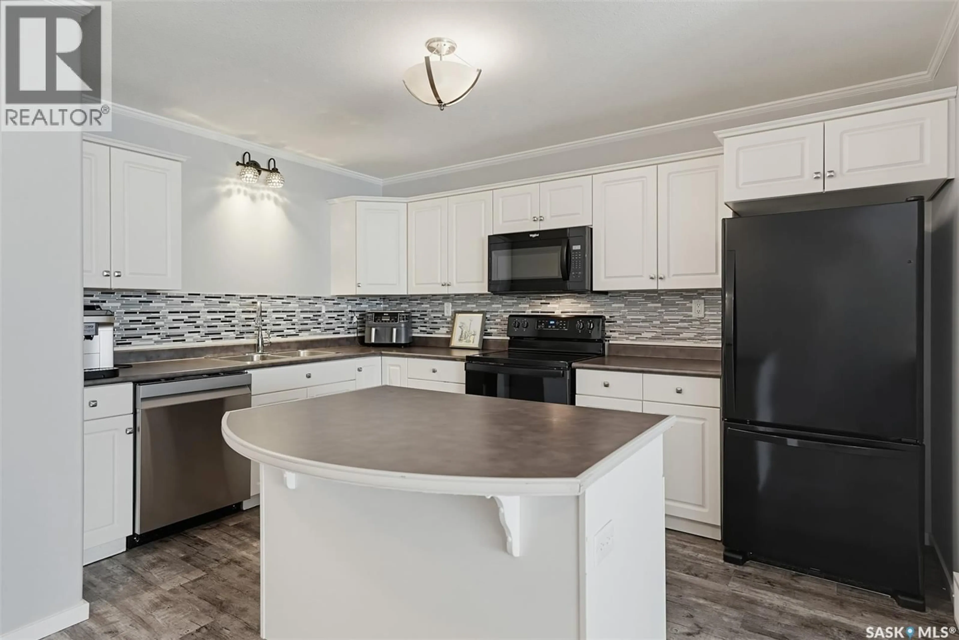Open concept kitchen, ceramic/tile floor for 904 715 HART ROAD, Saskatoon Saskatchewan S7M3Y8