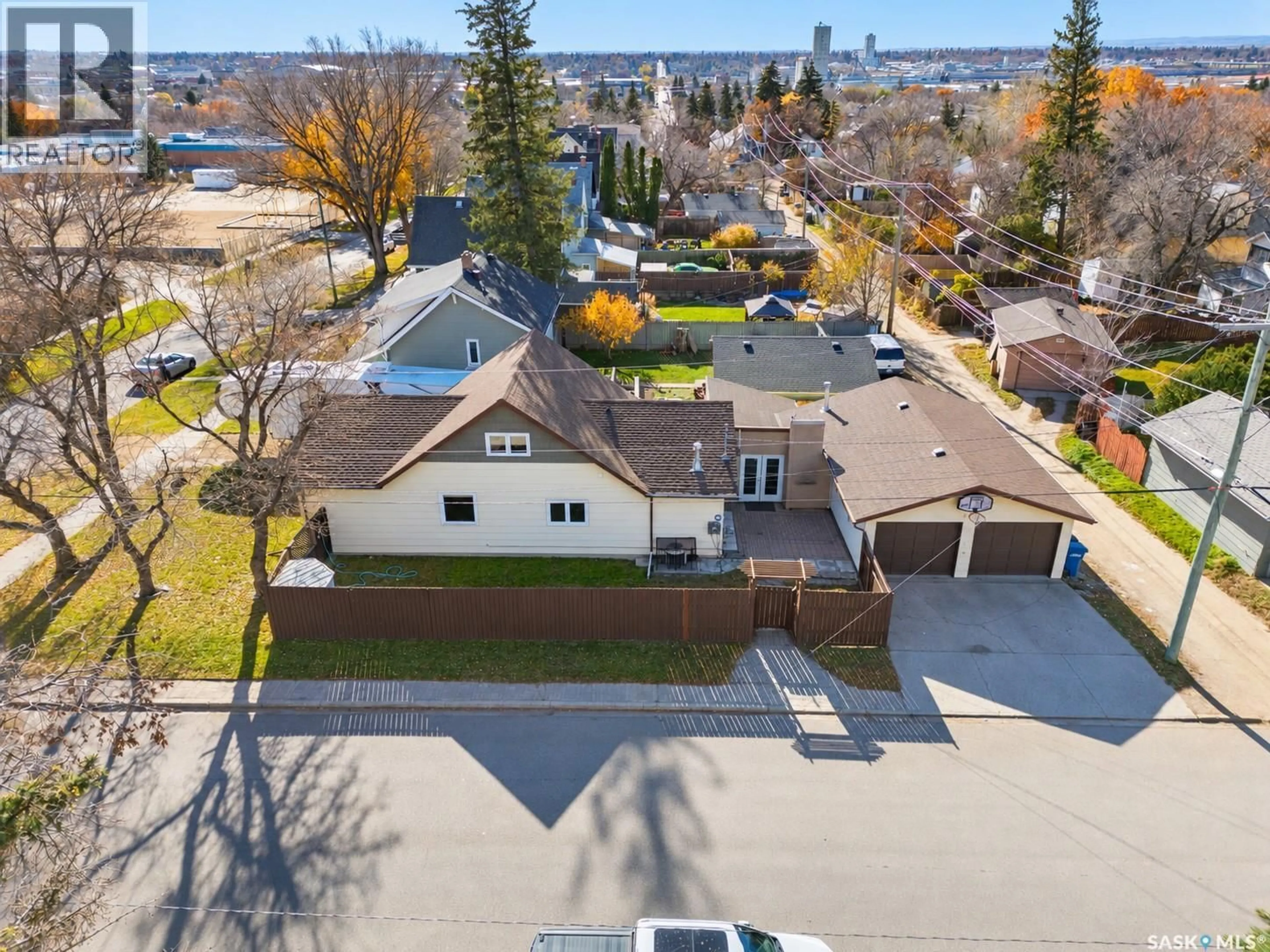 A pic from outside/outdoor area/front of a property/back of a property/a pic from drone, street for 1080 HENLEAZE AVENUE, Moose Jaw Saskatchewan S6H3V6