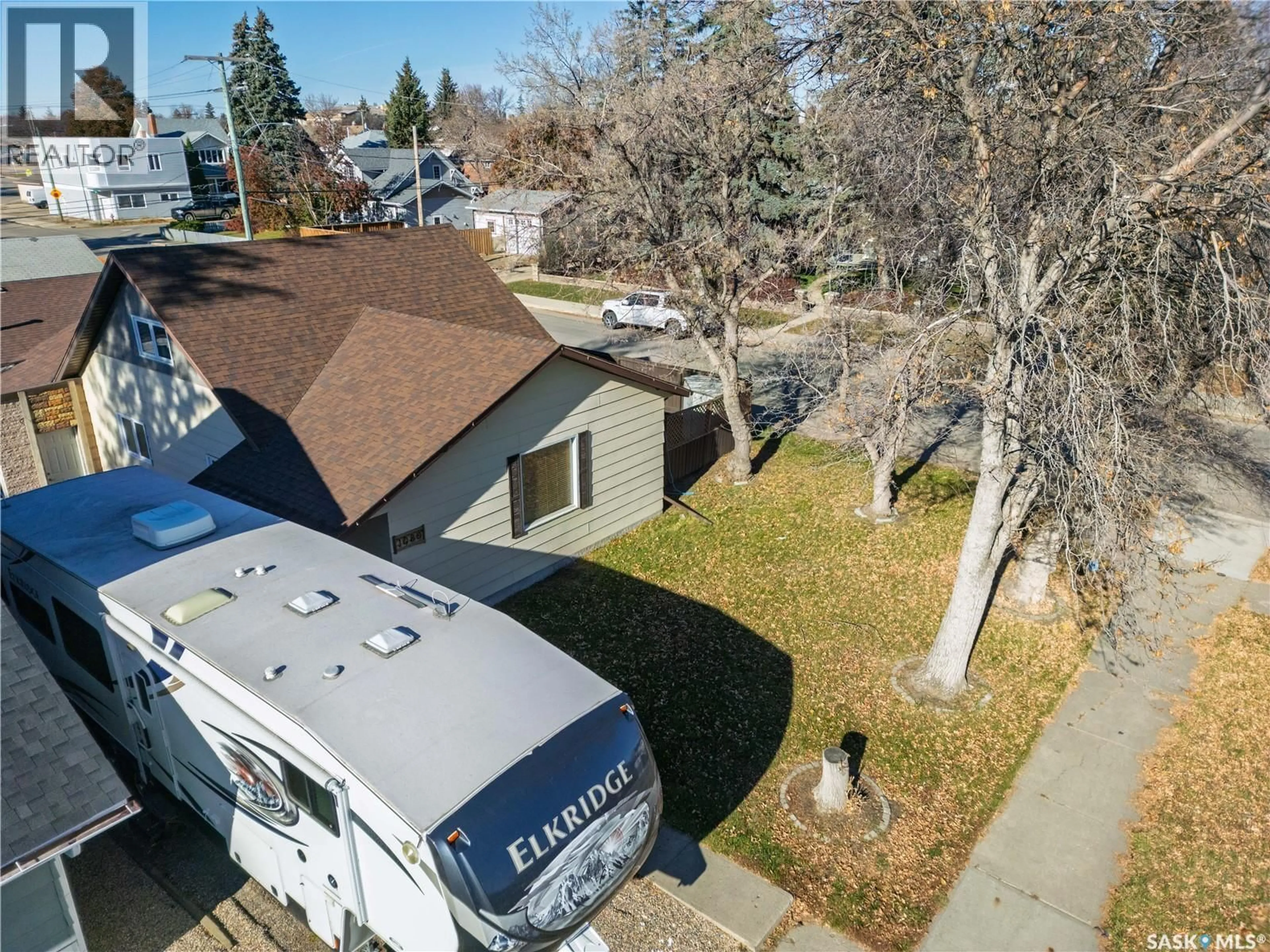 A pic from outside/outdoor area/front of a property/back of a property/a pic from drone, street for 1080 HENLEAZE AVENUE, Moose Jaw Saskatchewan S6H3V6