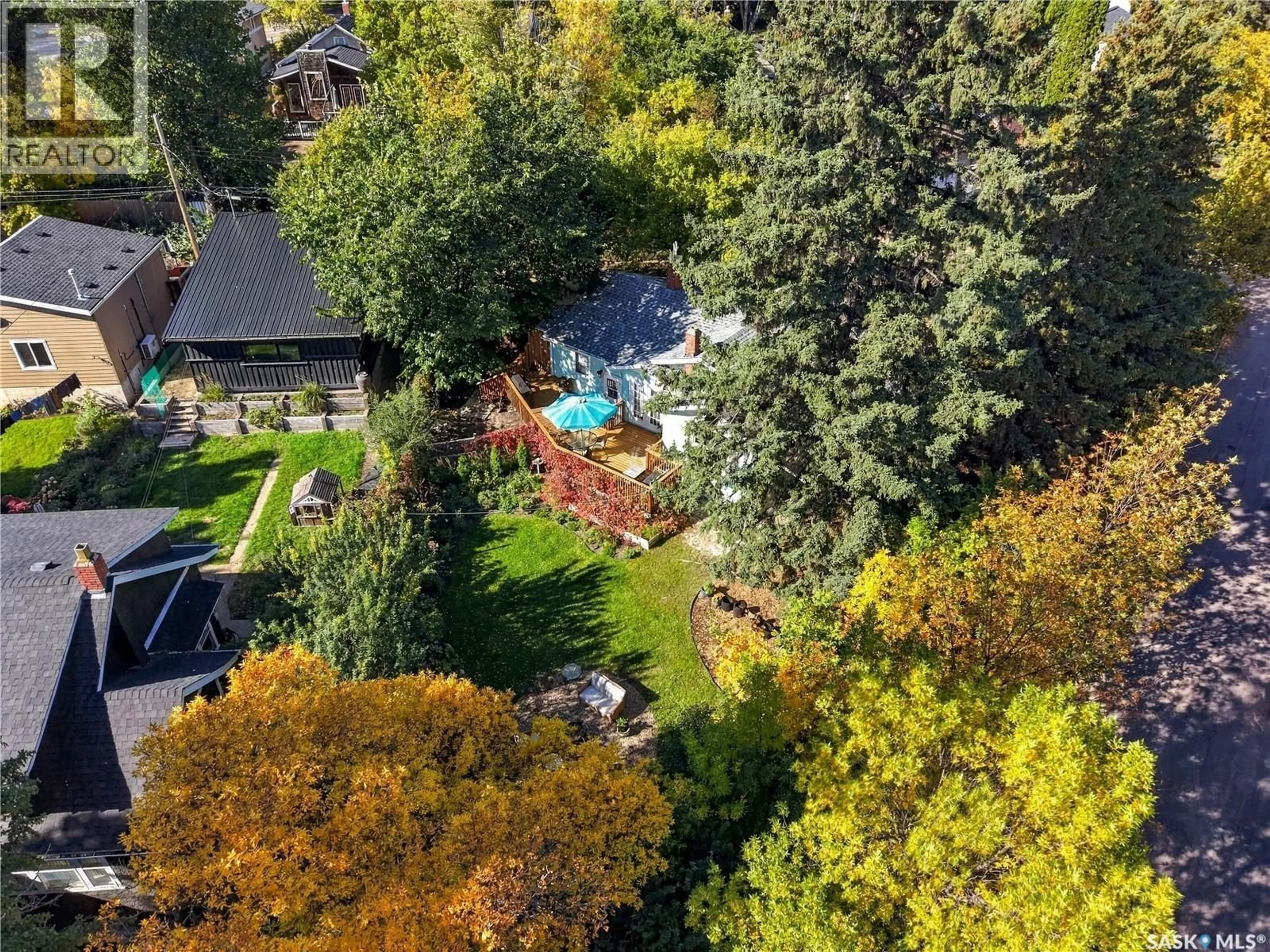 A pic from outside/outdoor area/front of a property/back of a property/a pic from drone, forest/trees view for 600 WALMER ROAD, Saskatoon Saskatchewan S7L0E2