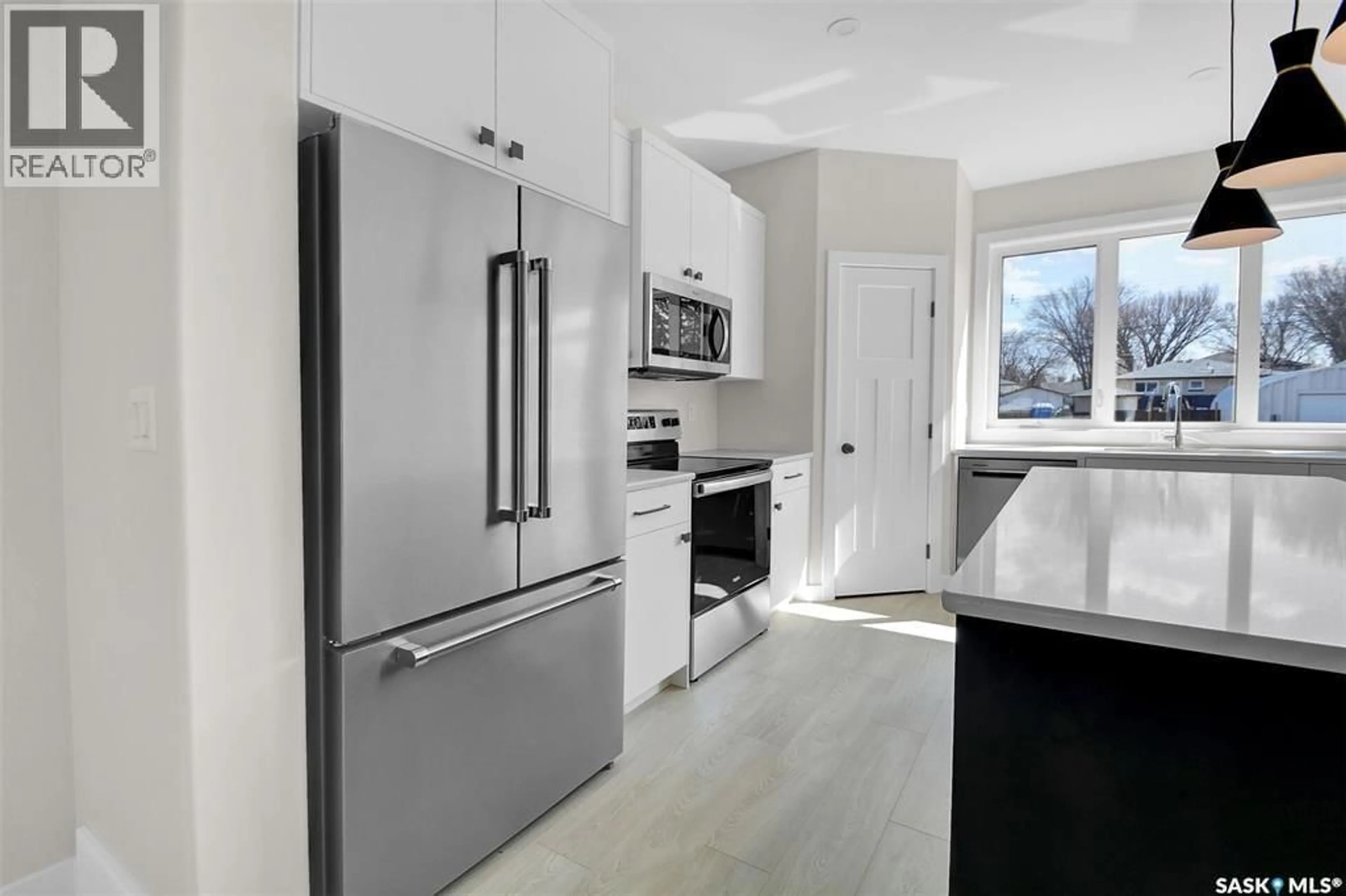Open concept kitchen, ceramic/tile floor for 129A 107TH STREET, Saskatoon Saskatchewan S7N1P2