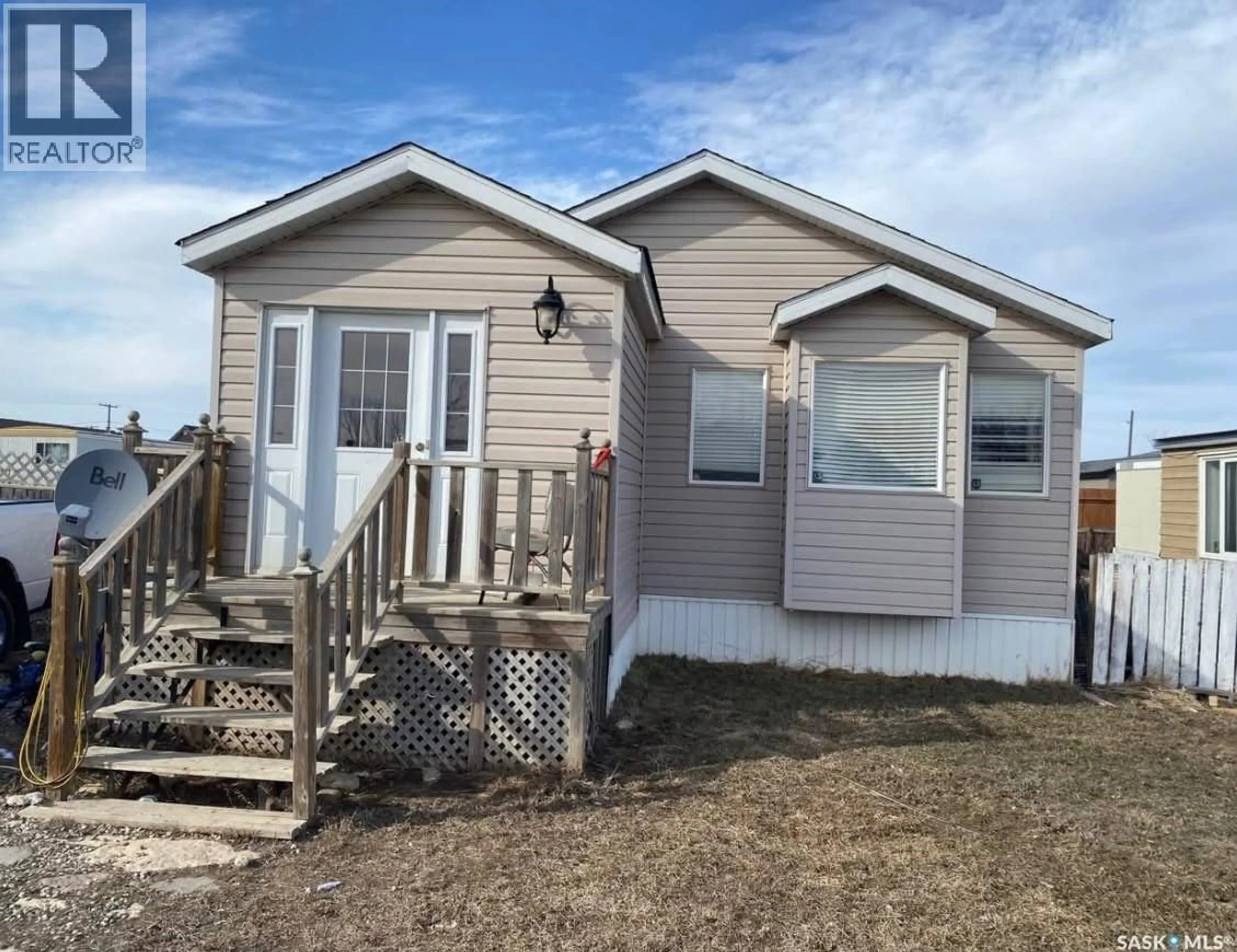 Home with vinyl exterior material, unknown for SW - 23 106 1ST AVENUE, Weyburn Saskatchewan S4H2J1