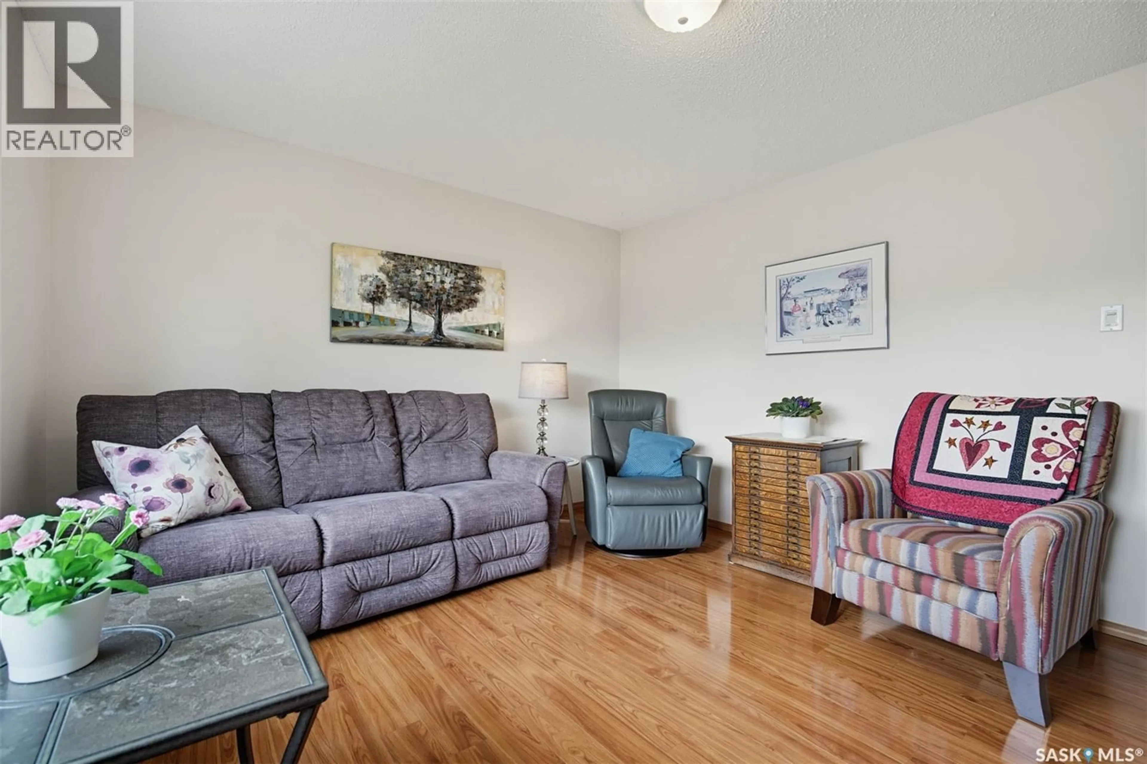 Living room with furniture, wood/laminate floor for 41 ARNASON CRESCENT, Saskatoon Saskatchewan S7H4M7