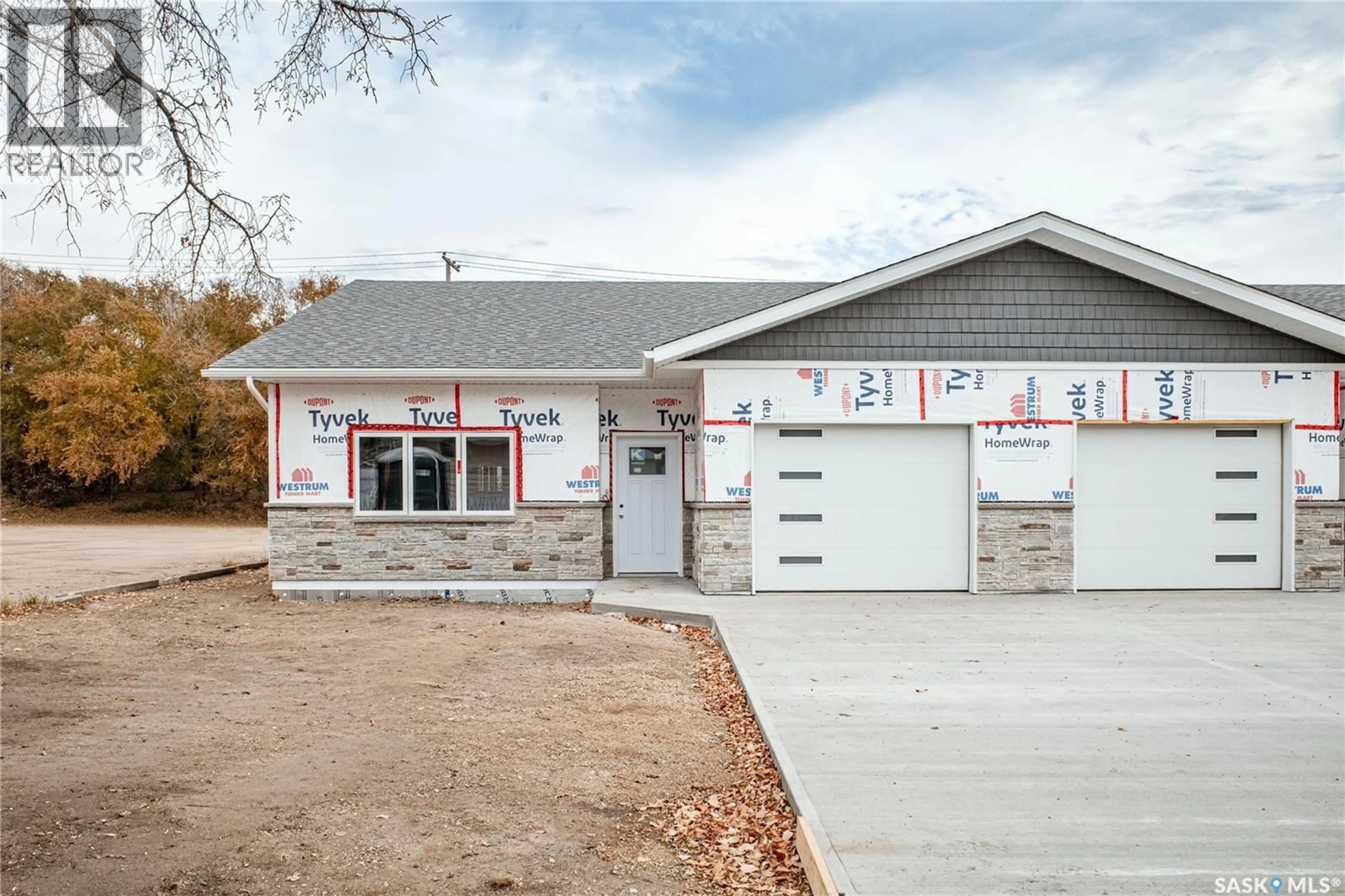 Home with vinyl exterior material, building for NE - 4 129 3RD AVENUE, Moose Jaw Saskatchewan S6H8A9