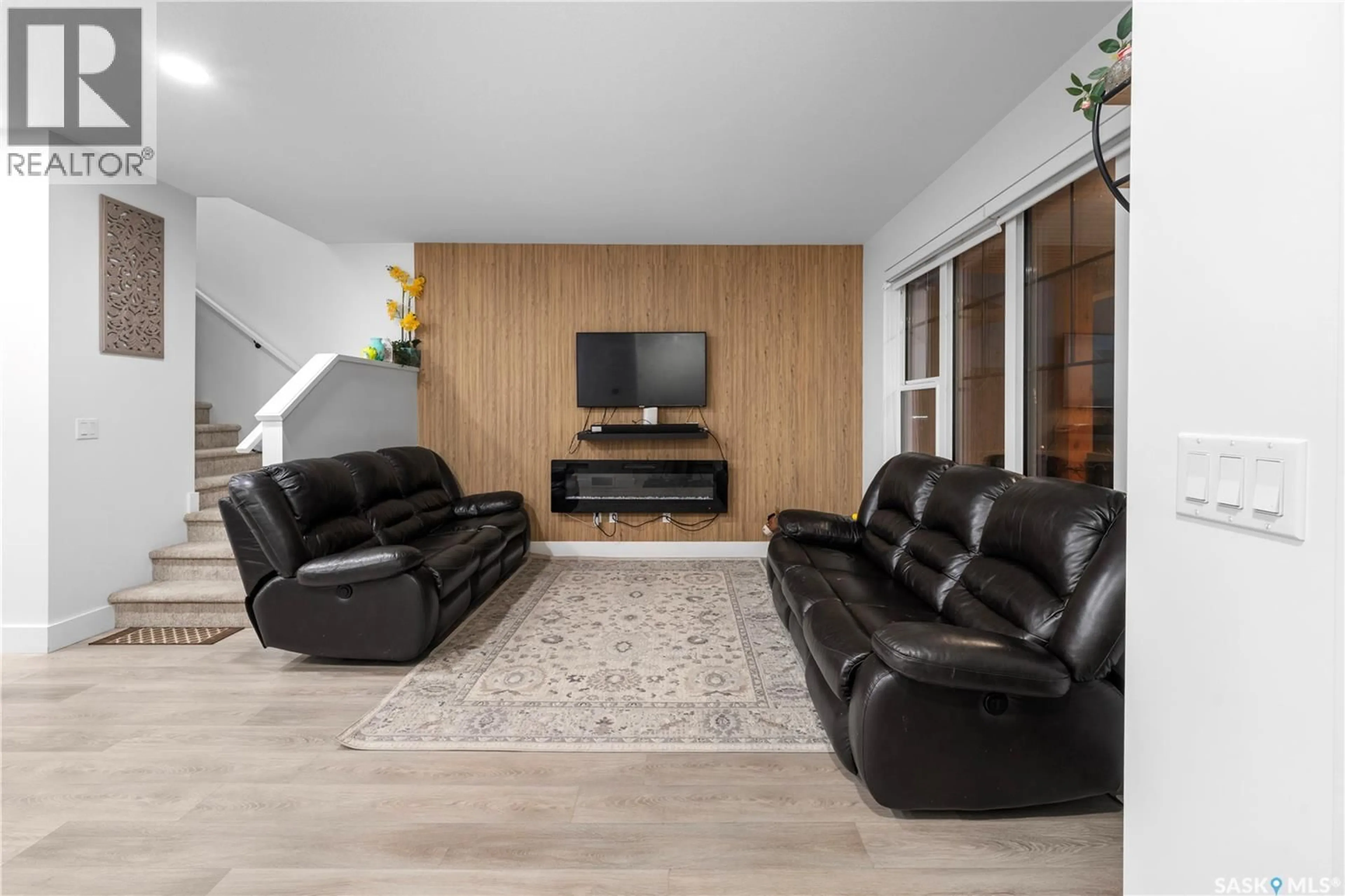 Living room with furniture, wood/laminate floor for 148 ROSEWOOD BOULEVARD, Saskatoon Saskatchewan S7V0Y9