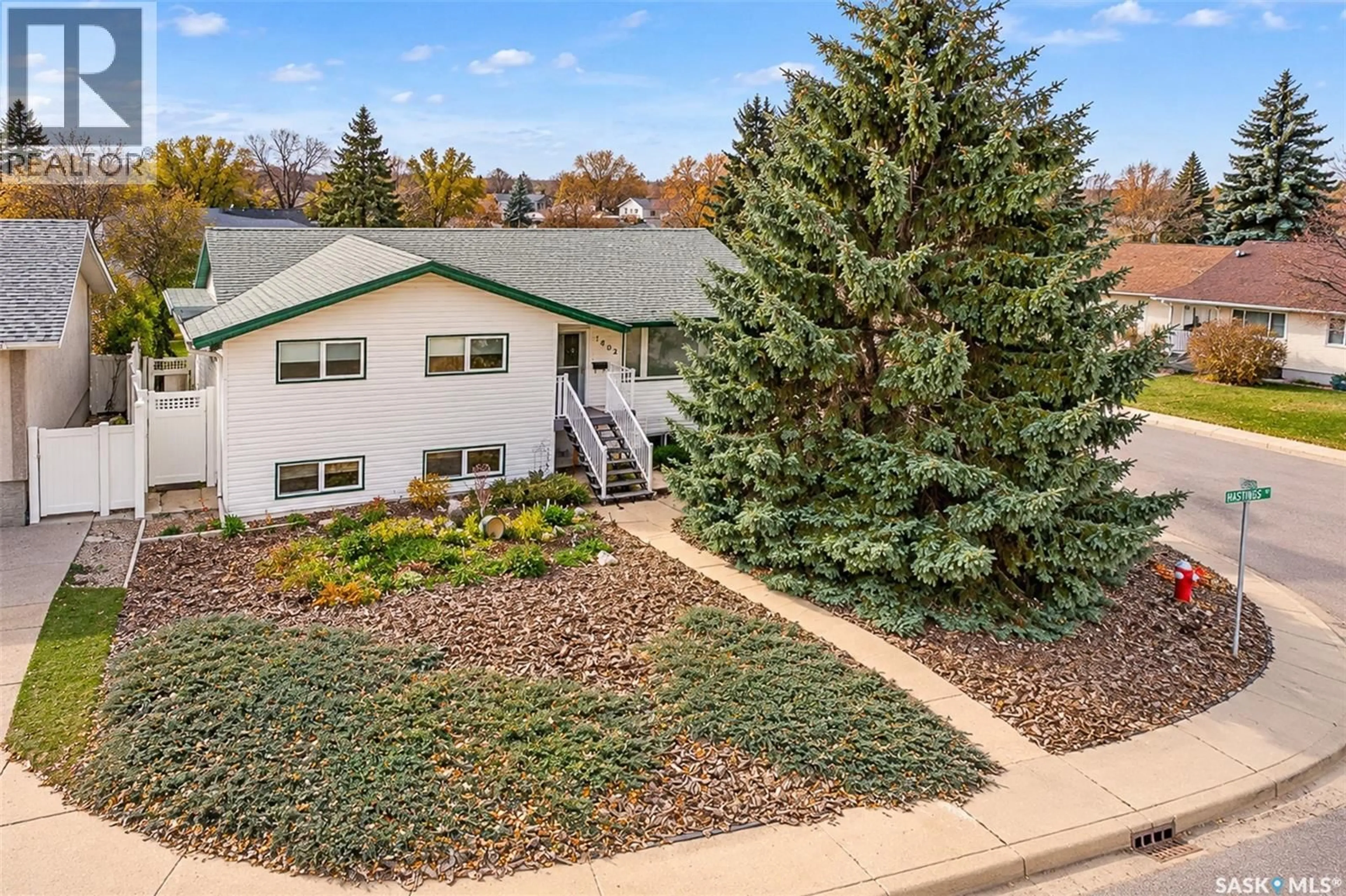A pic from outside/outdoor area/front of a property/back of a property/a pic from drone, mountain view for 1402 HASTINGS STREET, Moose Jaw Saskatchewan S6H6W3