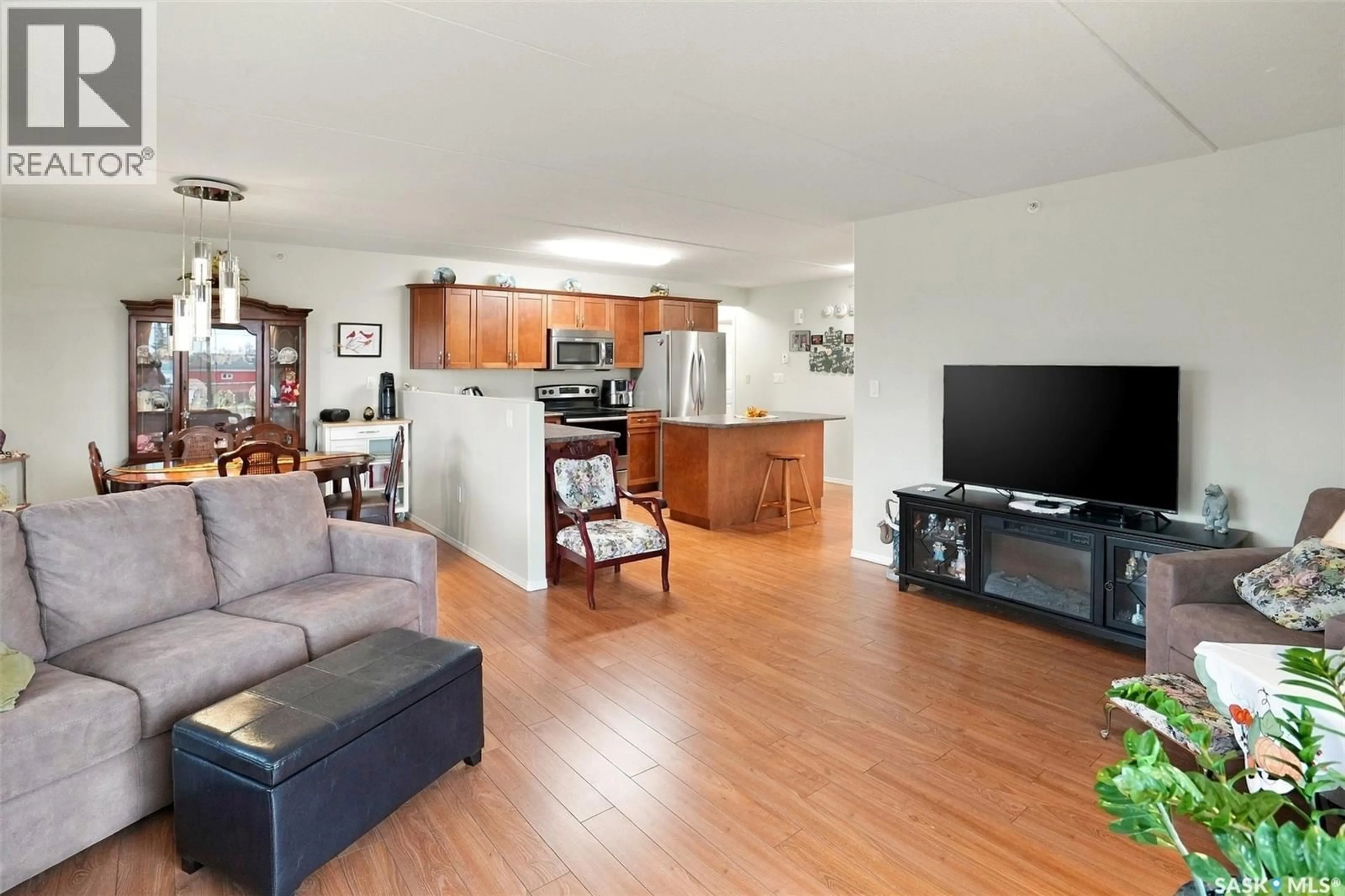 Living room with furniture, wood/laminate floor for 207 2 18TH STREET, Battleford Saskatchewan S0M0E0
