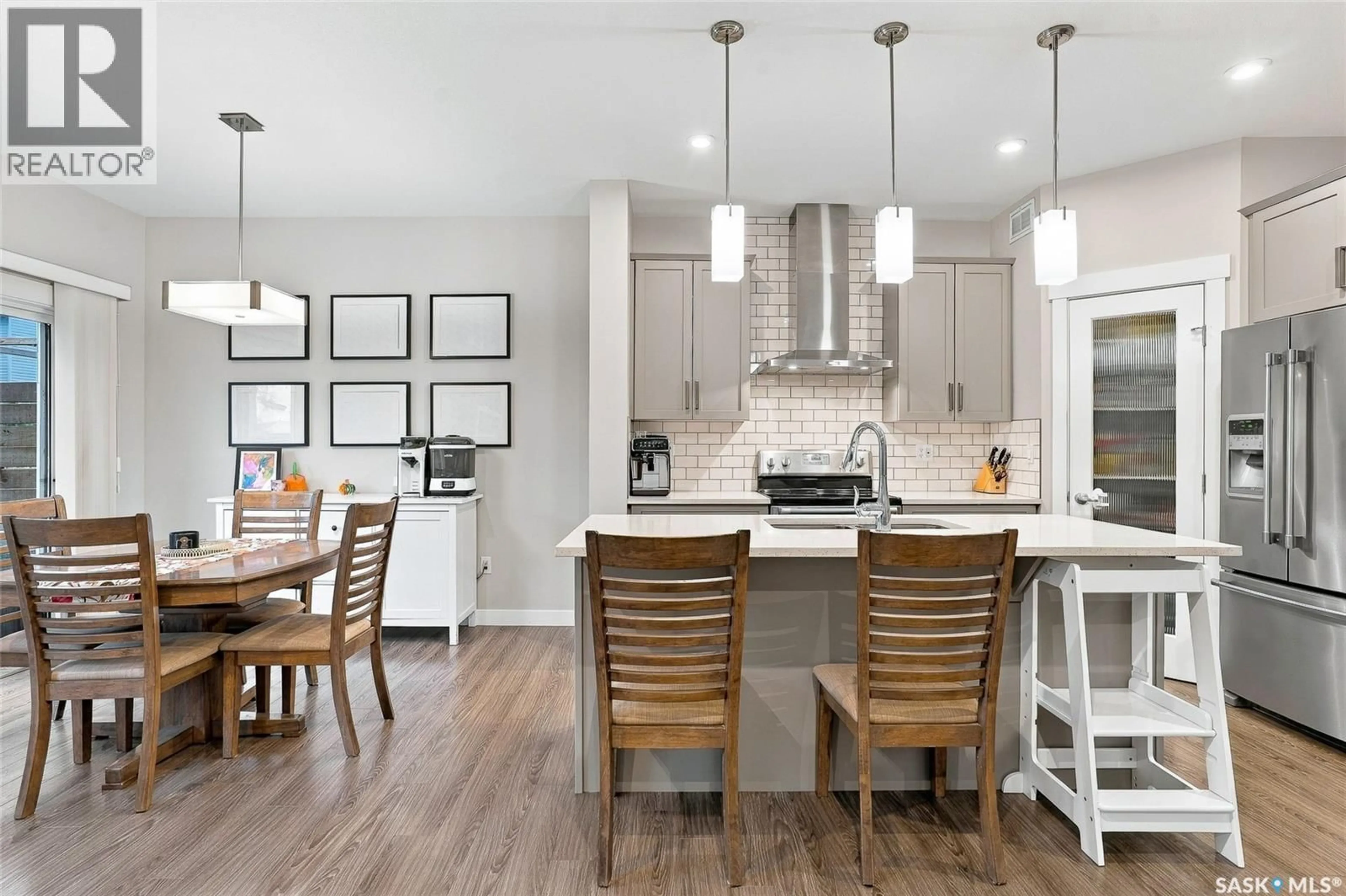 Open concept kitchen, wood/laminate floor for 422 SECORD WAY, Saskatoon Saskatchewan S7V0M1