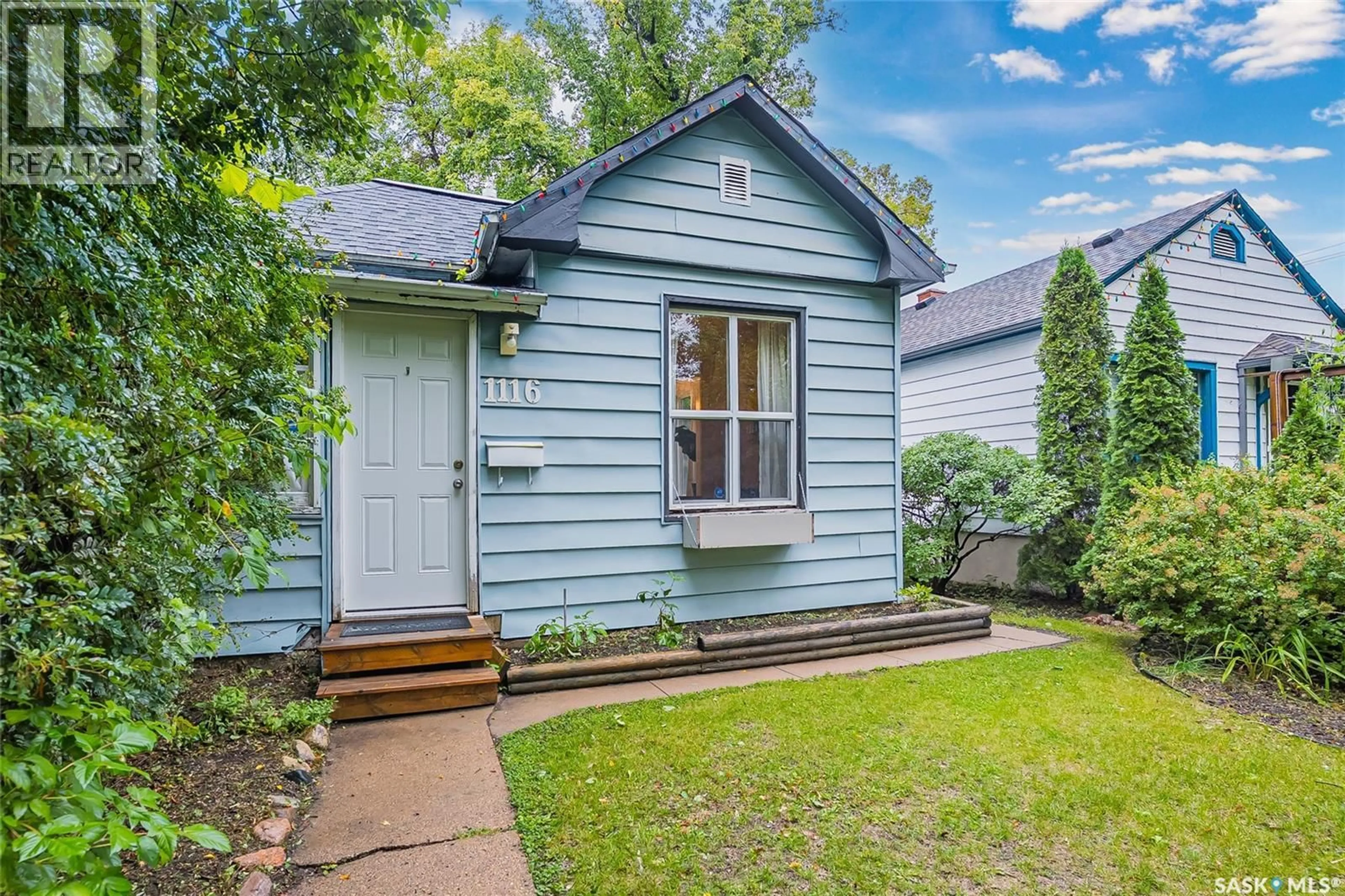 Home with vinyl exterior material, street for 1116 B AVENUE, Saskatoon Saskatchewan S7L1G1