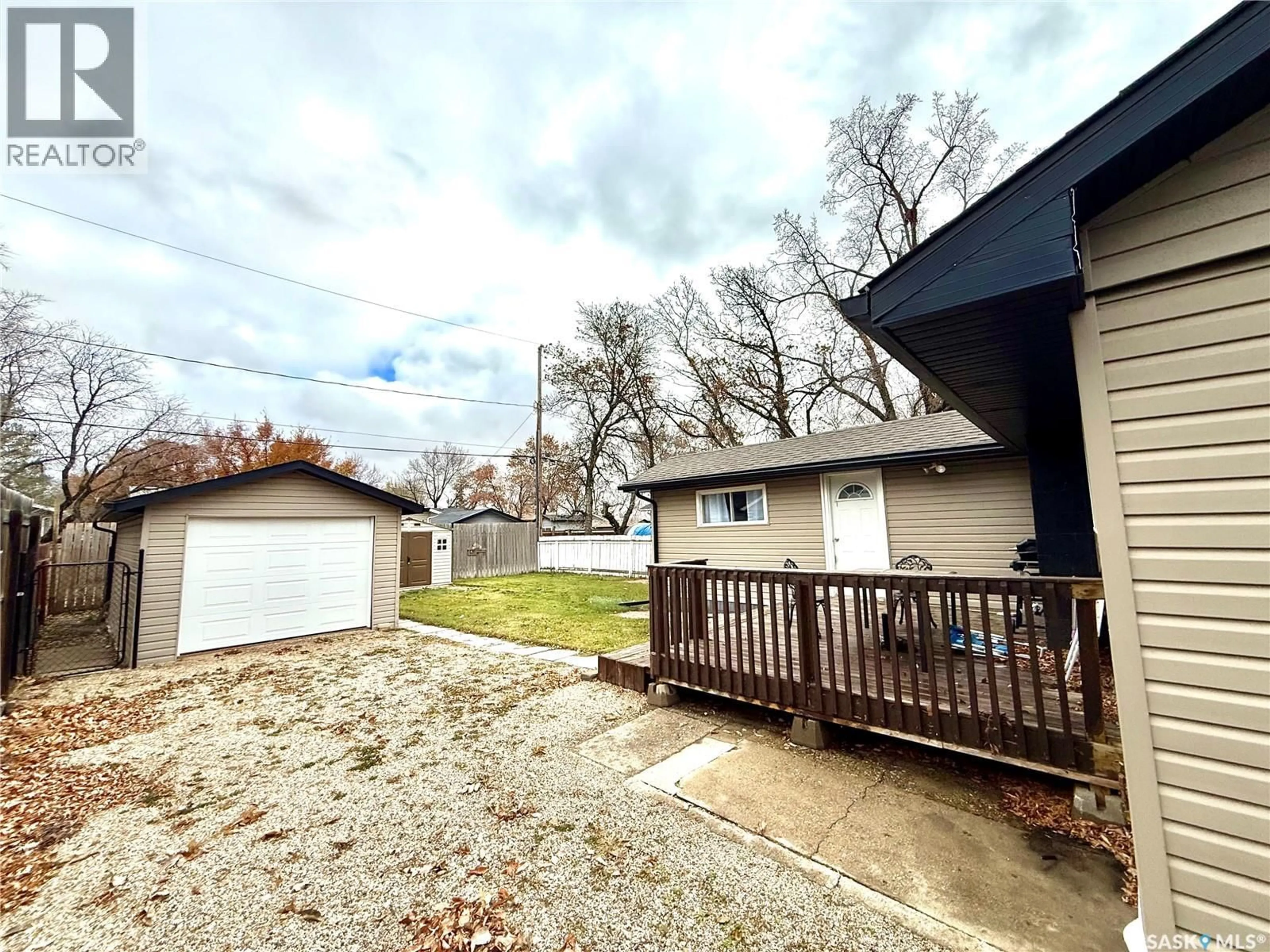 A pic from outside/outdoor area/front of a property/back of a property/a pic from drone, street for 64 10TH STREET, Weyburn Saskatchewan S4H1G7