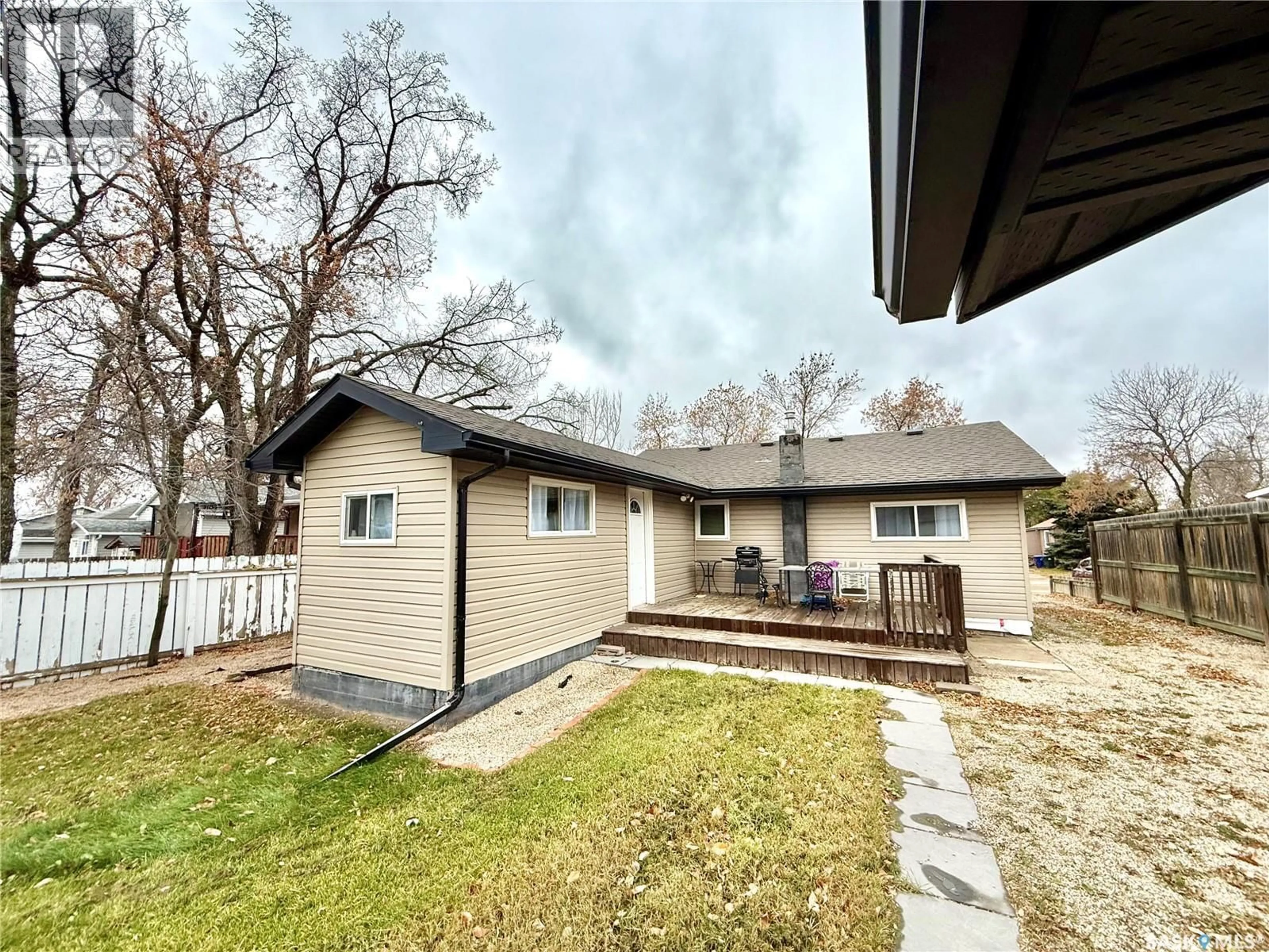 A pic from outside/outdoor area/front of a property/back of a property/a pic from drone, street for 64 10TH STREET, Weyburn Saskatchewan S4H1G7