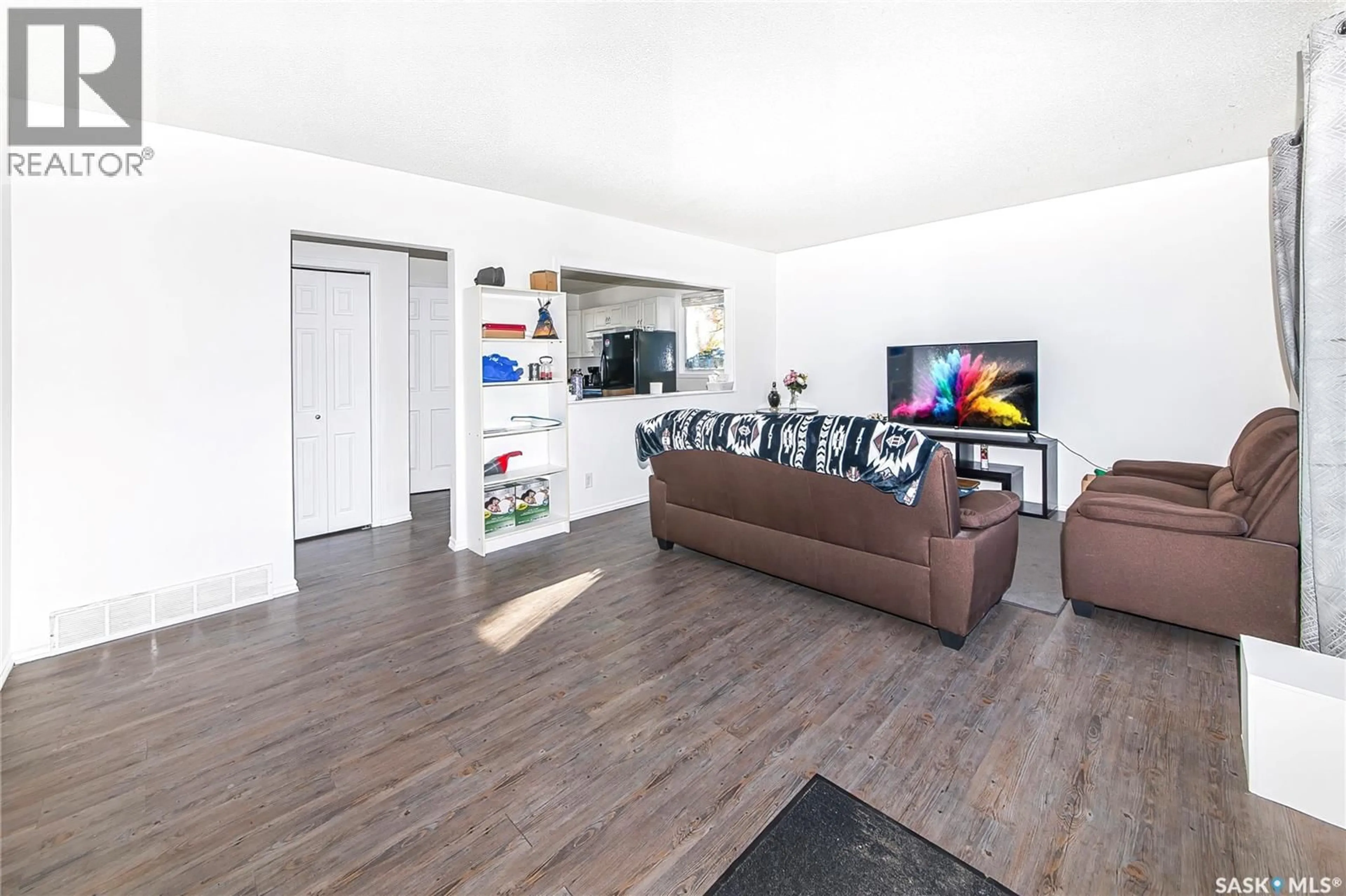 Living room with furniture, wood/laminate floor for 126 Y AVENUE, Saskatoon Saskatchewan S7M3J3