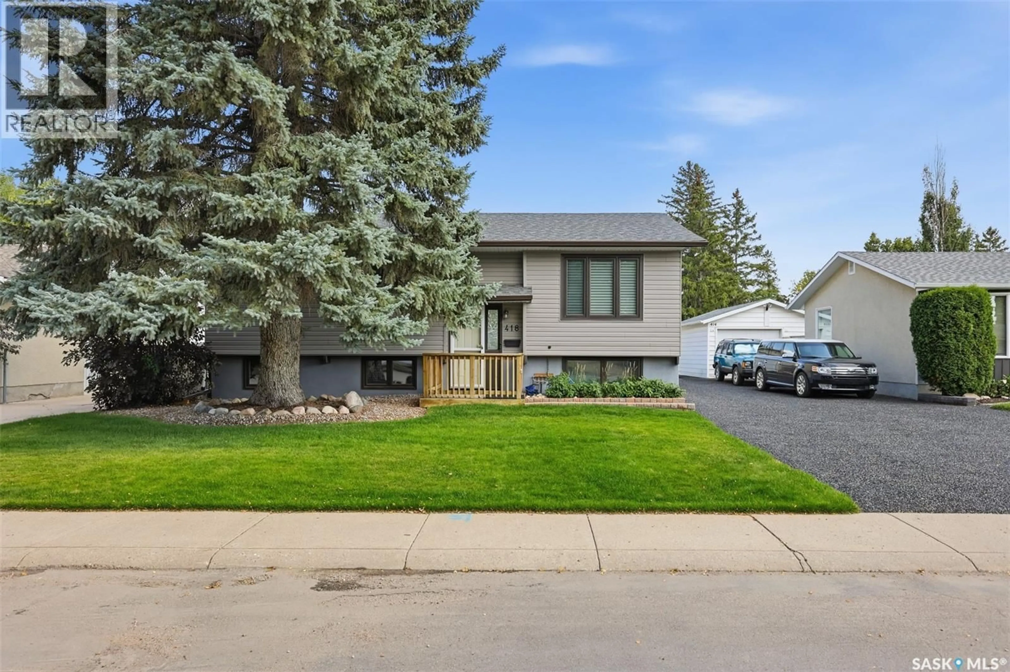 Home with vinyl exterior material, street for 418 LAVAL CRESCENT, Saskatoon Saskatchewan S7H4K9