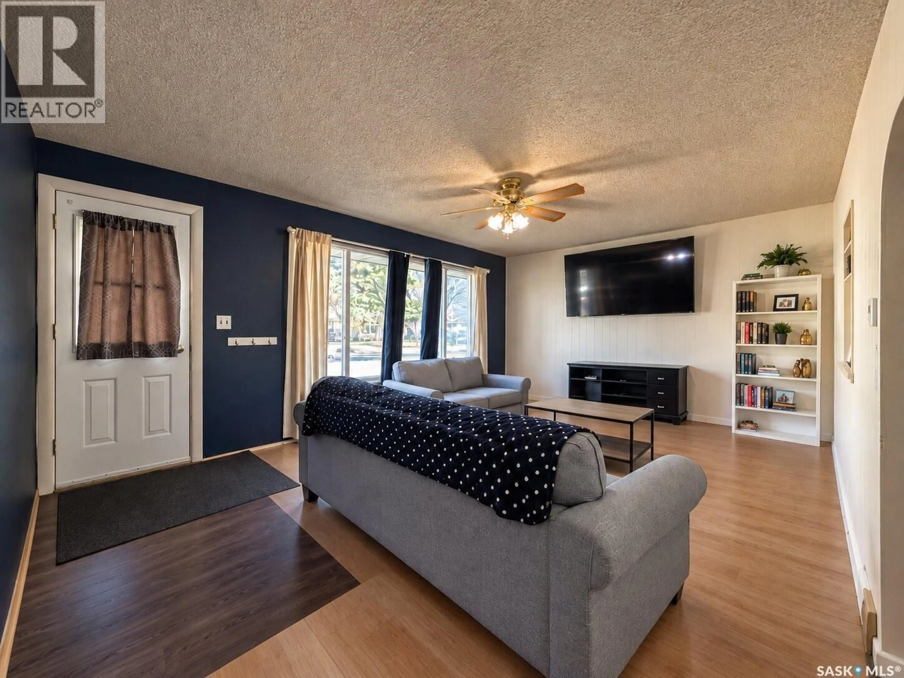 Living room with furniture, wood/laminate floor for 777 3RD STREET, Shaunavon Saskatchewan S0N2M0