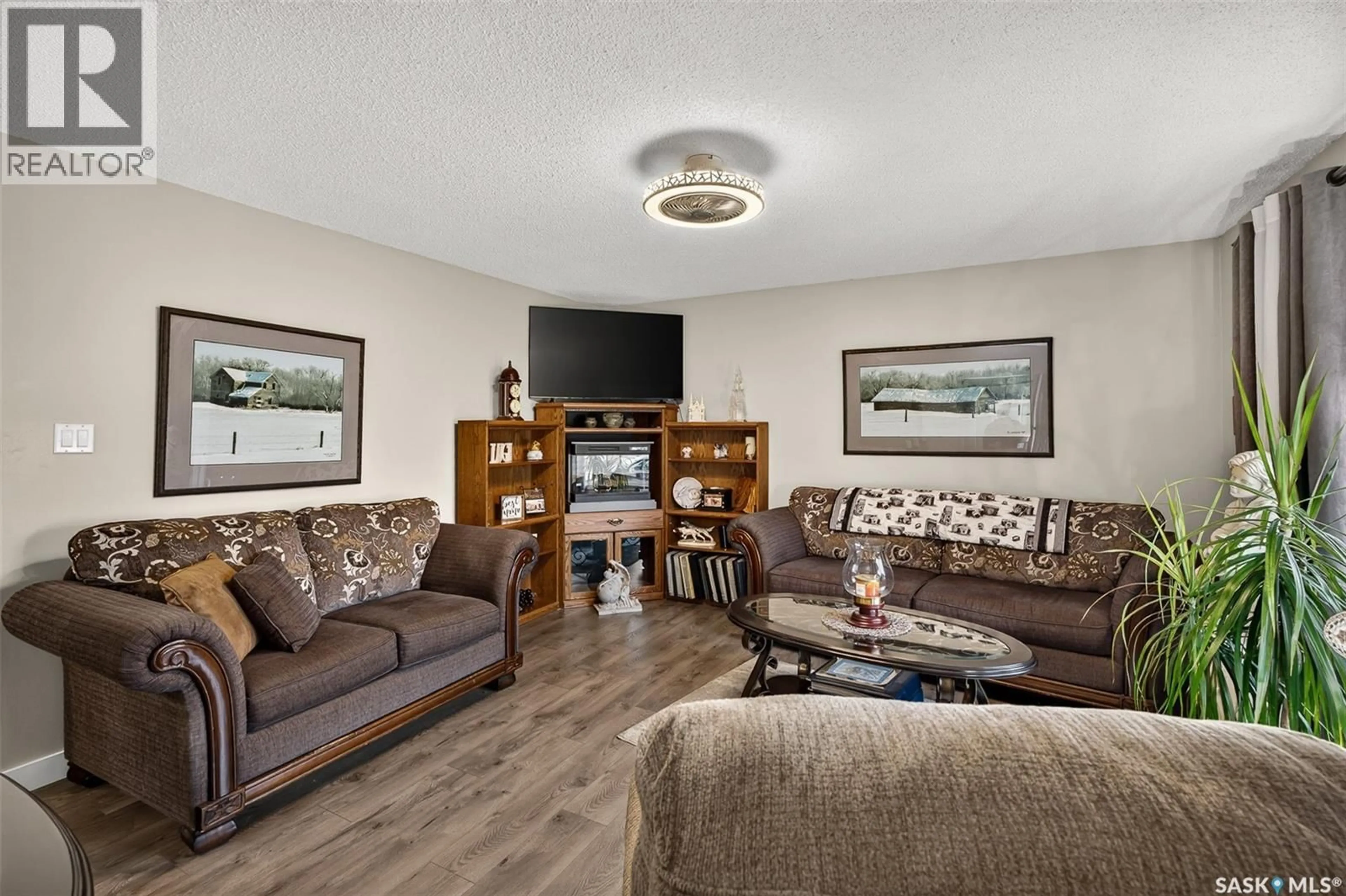Living room with furniture, unknown for 1056 SIMCOE STREET, Moose Jaw Saskatchewan S6H3J2