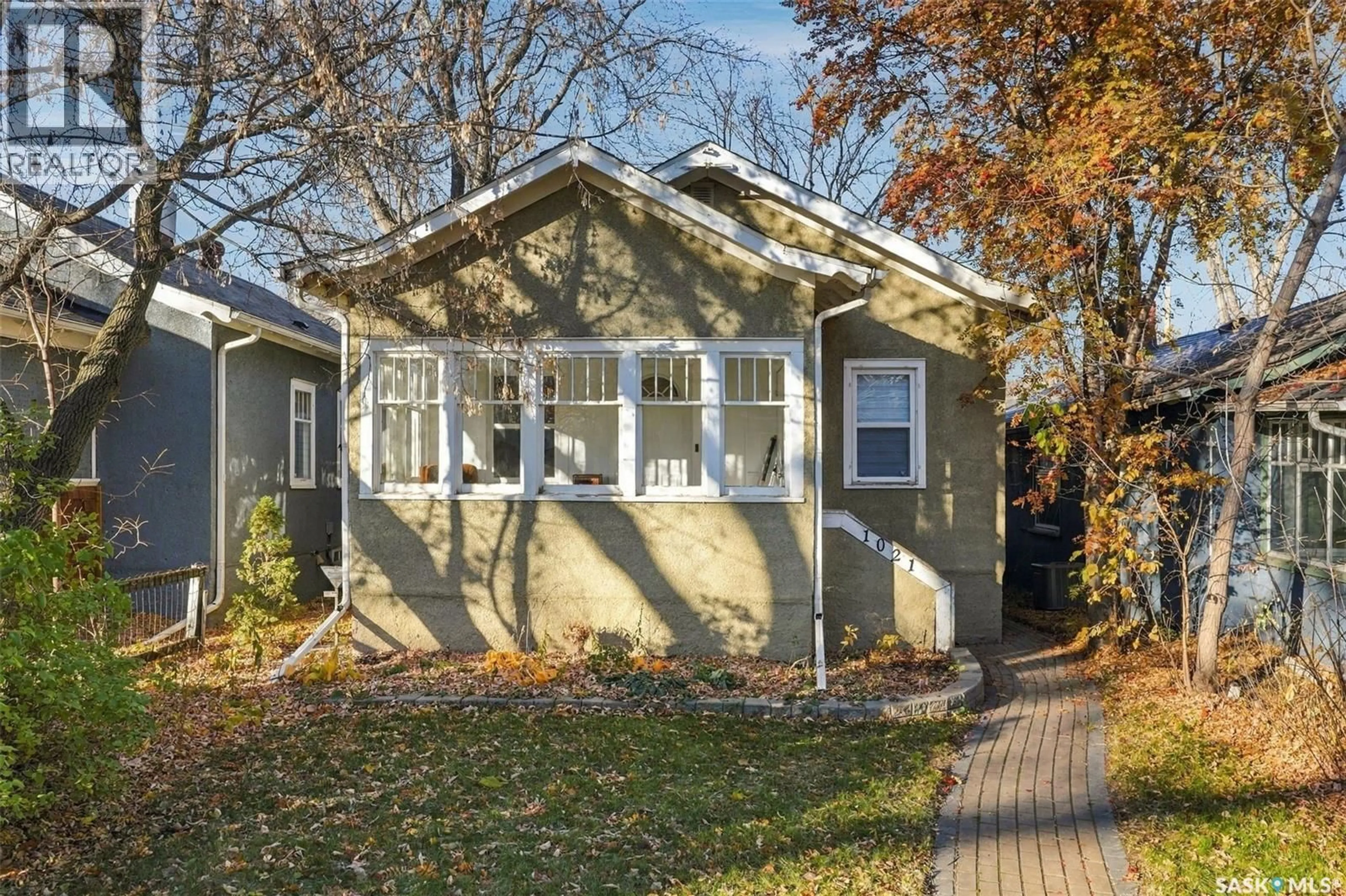 Home with vinyl exterior material, street for N - 1021 C AVENUE, Saskatoon Saskatchewan S7L1K1