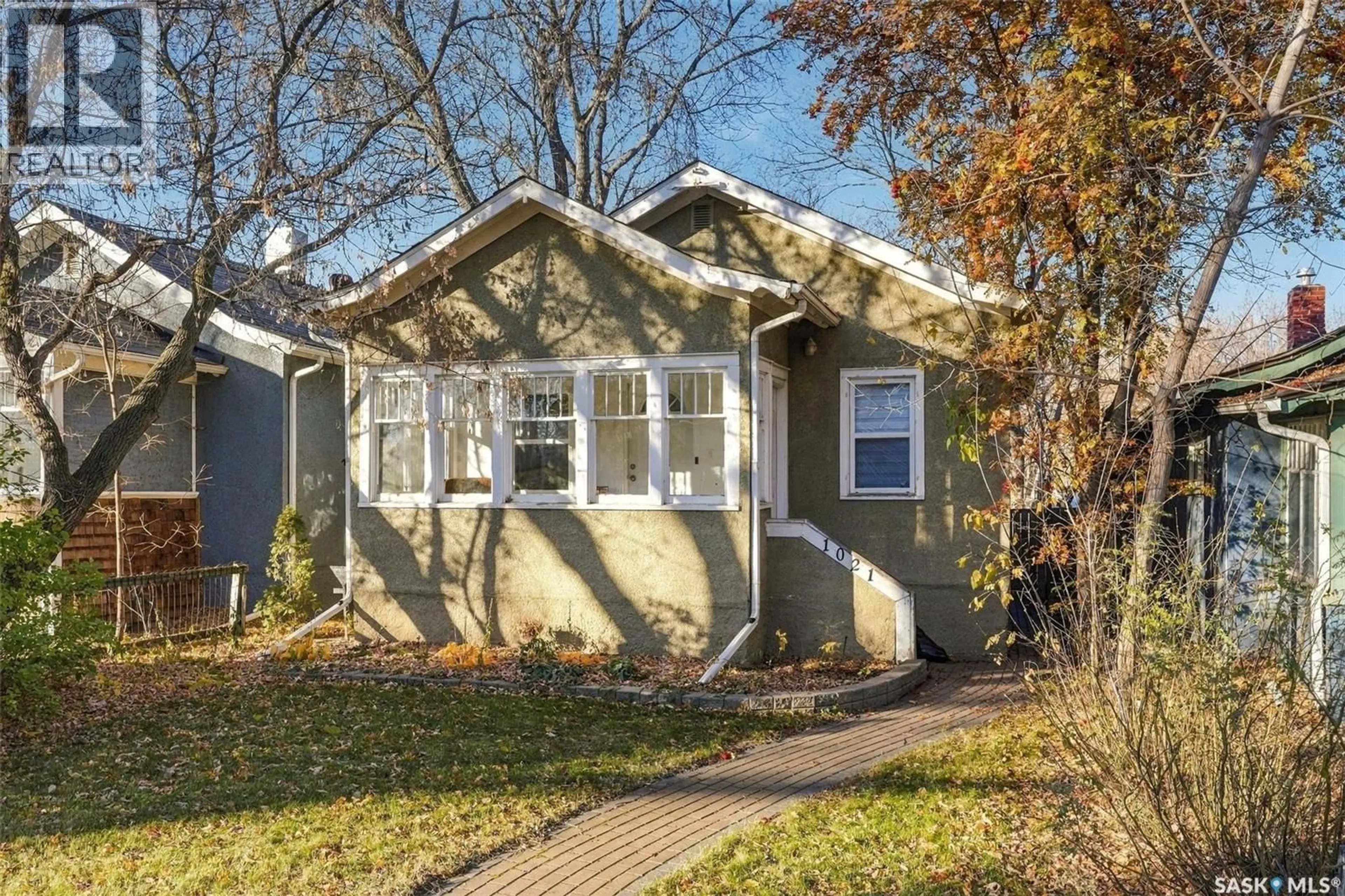 Home with vinyl exterior material, street for N - 1021 C AVENUE, Saskatoon Saskatchewan S7L1K1