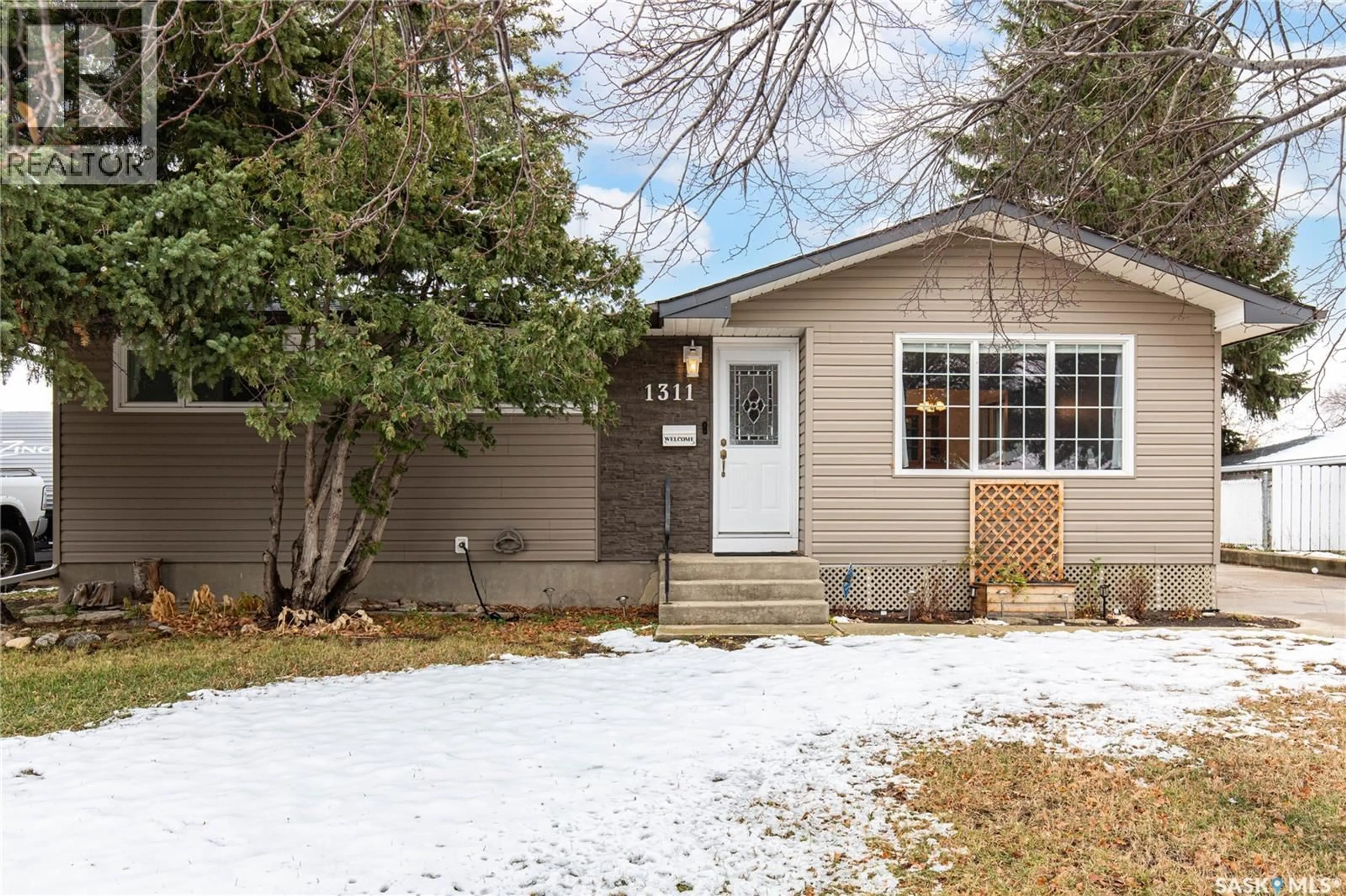 Home with vinyl exterior material, street for 1311 KING CRESCENT, Moose Jaw Saskatchewan S6H3G3