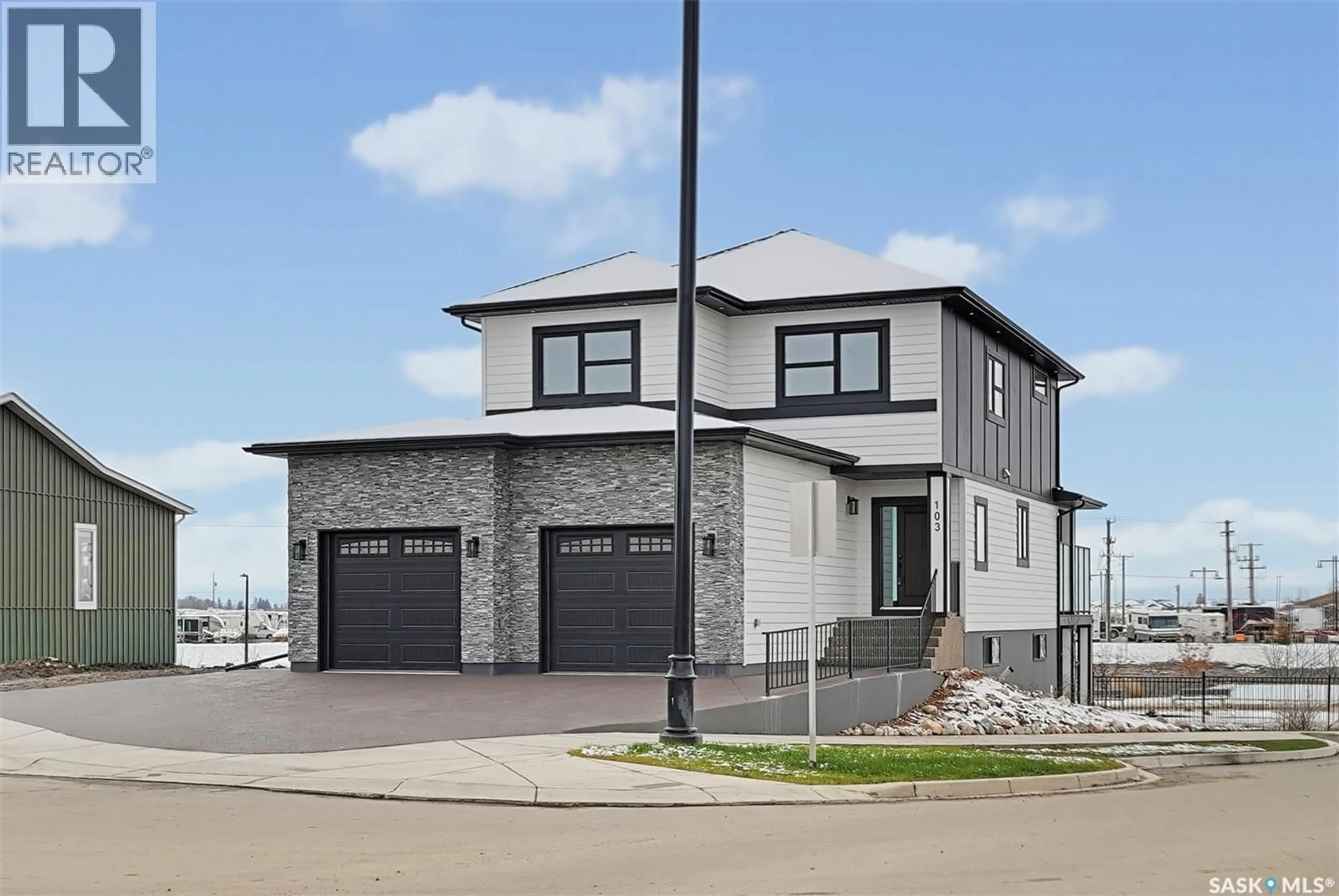 Home with brick exterior material, street for 103 NAZARALI WAY, Saskatoon Saskatchewan S7V1X8