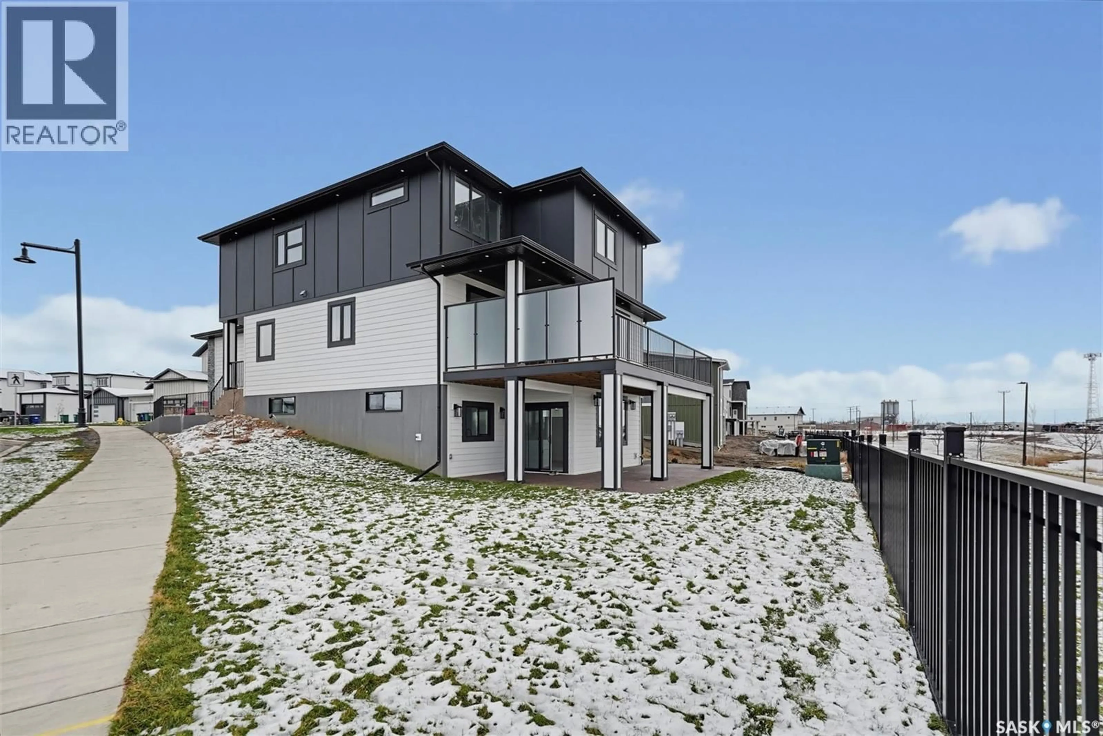 A pic from outside/outdoor area/front of a property/back of a property/a pic from drone, unknown for 103 NAZARALI WAY, Saskatoon Saskatchewan S7V1X8