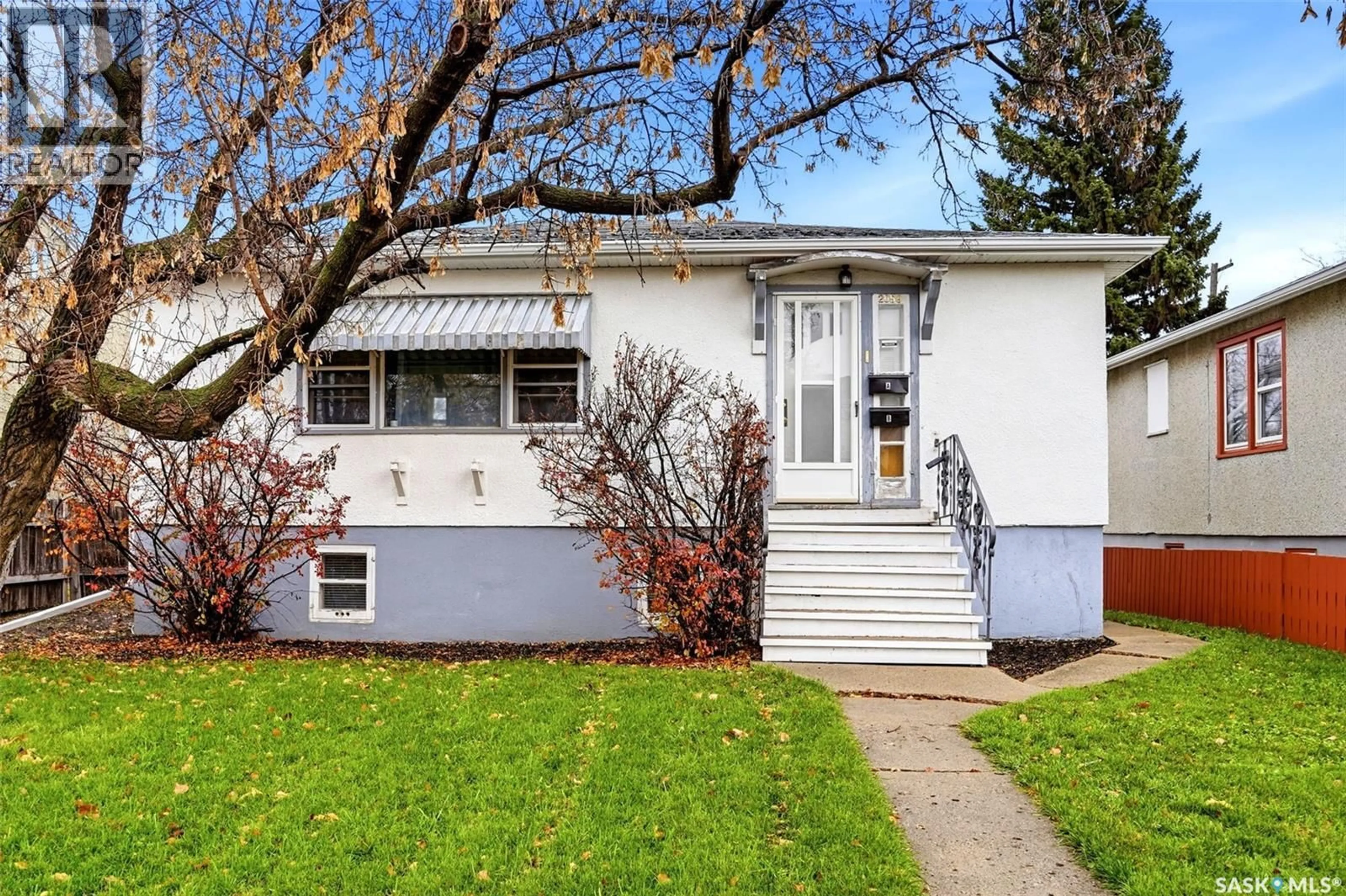 Home with vinyl exterior material, street for 2059 PASQUA STREET, Regina Saskatchewan S4T4M1