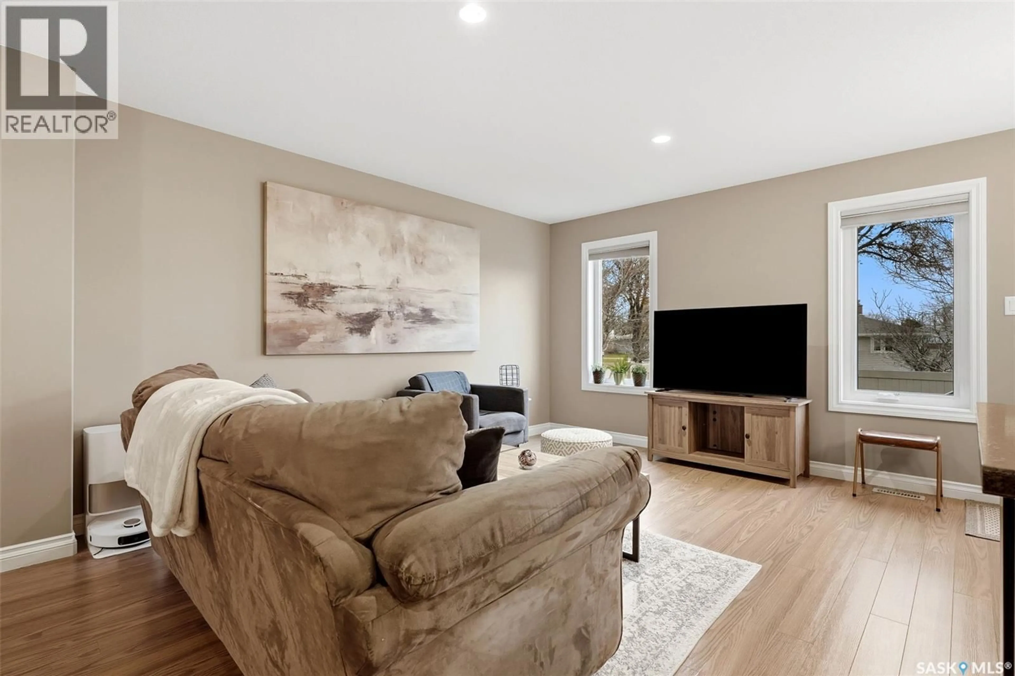 Living room with furniture, wood/laminate floor for 182 DE MARCO POINTE LANE, Regina Saskatchewan S4T1E8