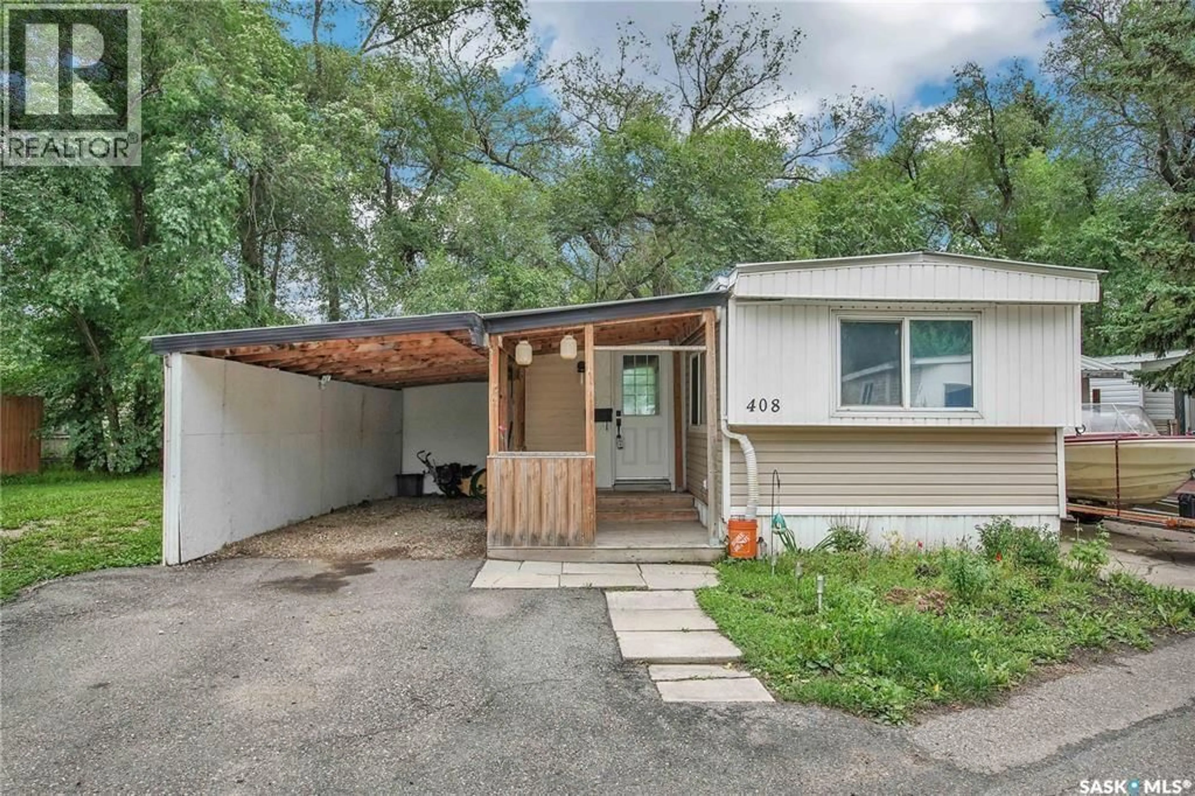 Home with vinyl exterior material, street for 408 1524 RAYNER AVENUE, Saskatoon Saskatchewan S7N1Y1