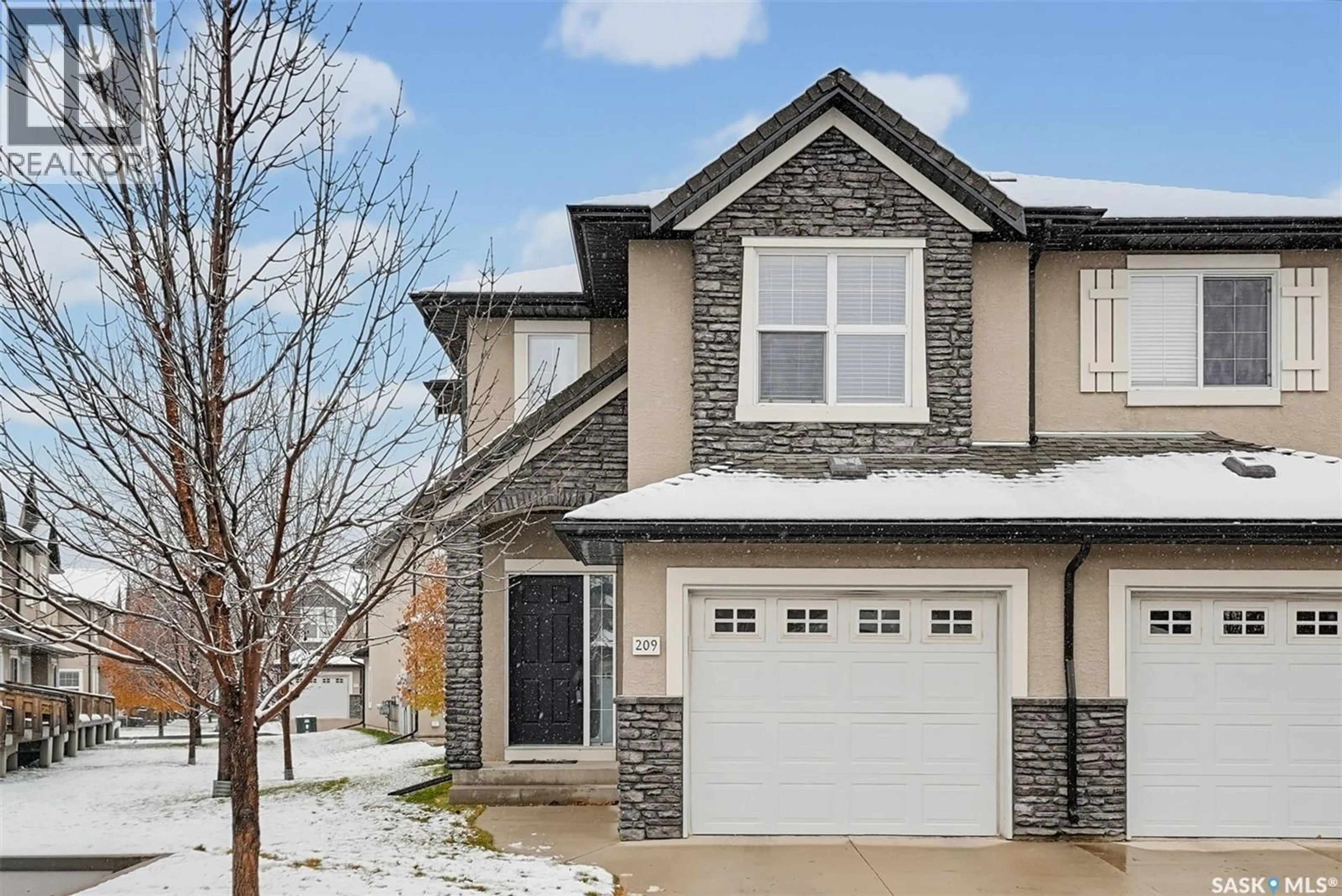 Home with brick exterior material, street for 209 - 410 HUNTER ROAD, Saskatoon Saskatchewan S7T1C9