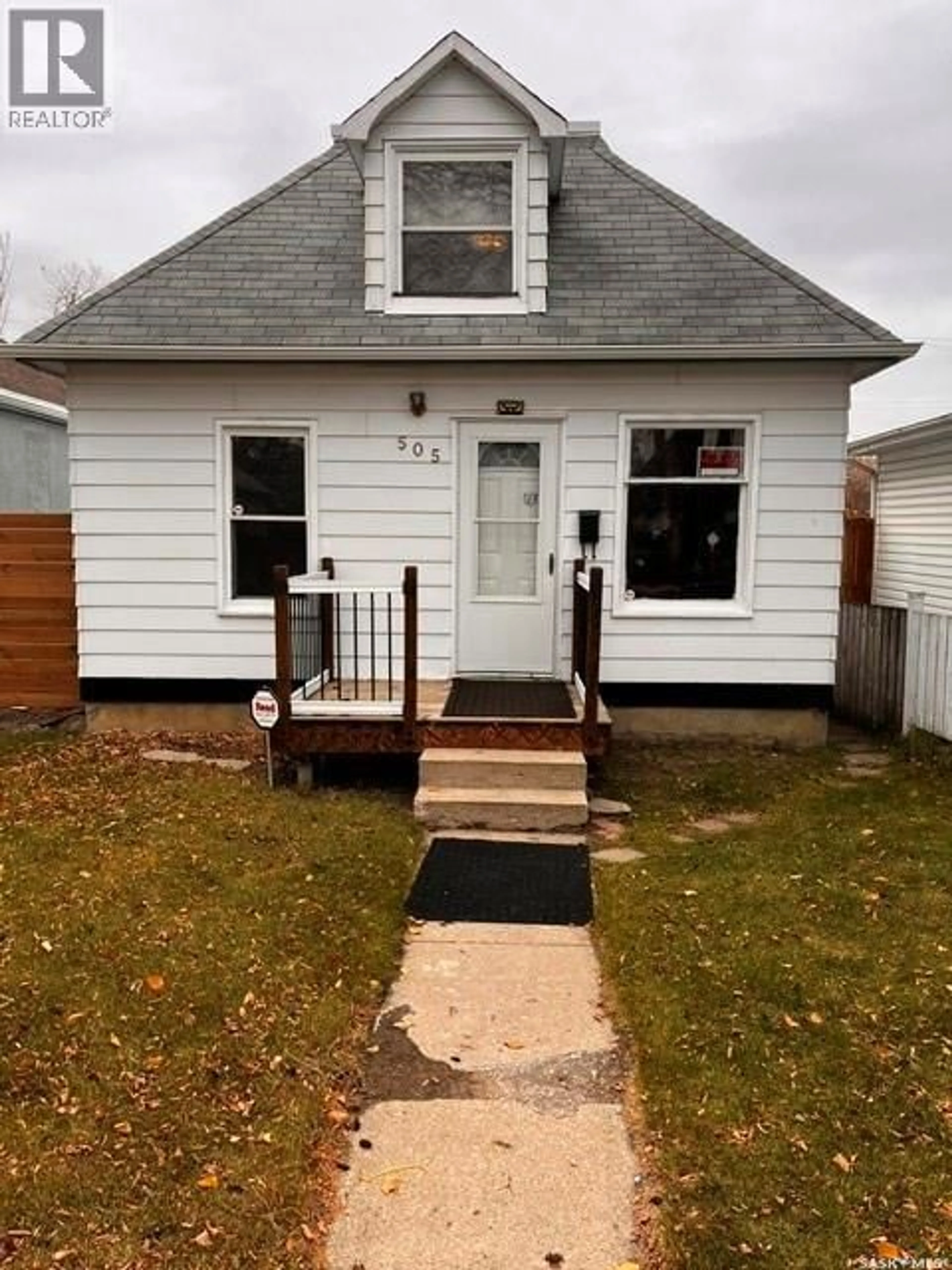 Home with vinyl exterior material, street for 505 I AVENUE, Saskatoon Saskatchewan S7M1Y6