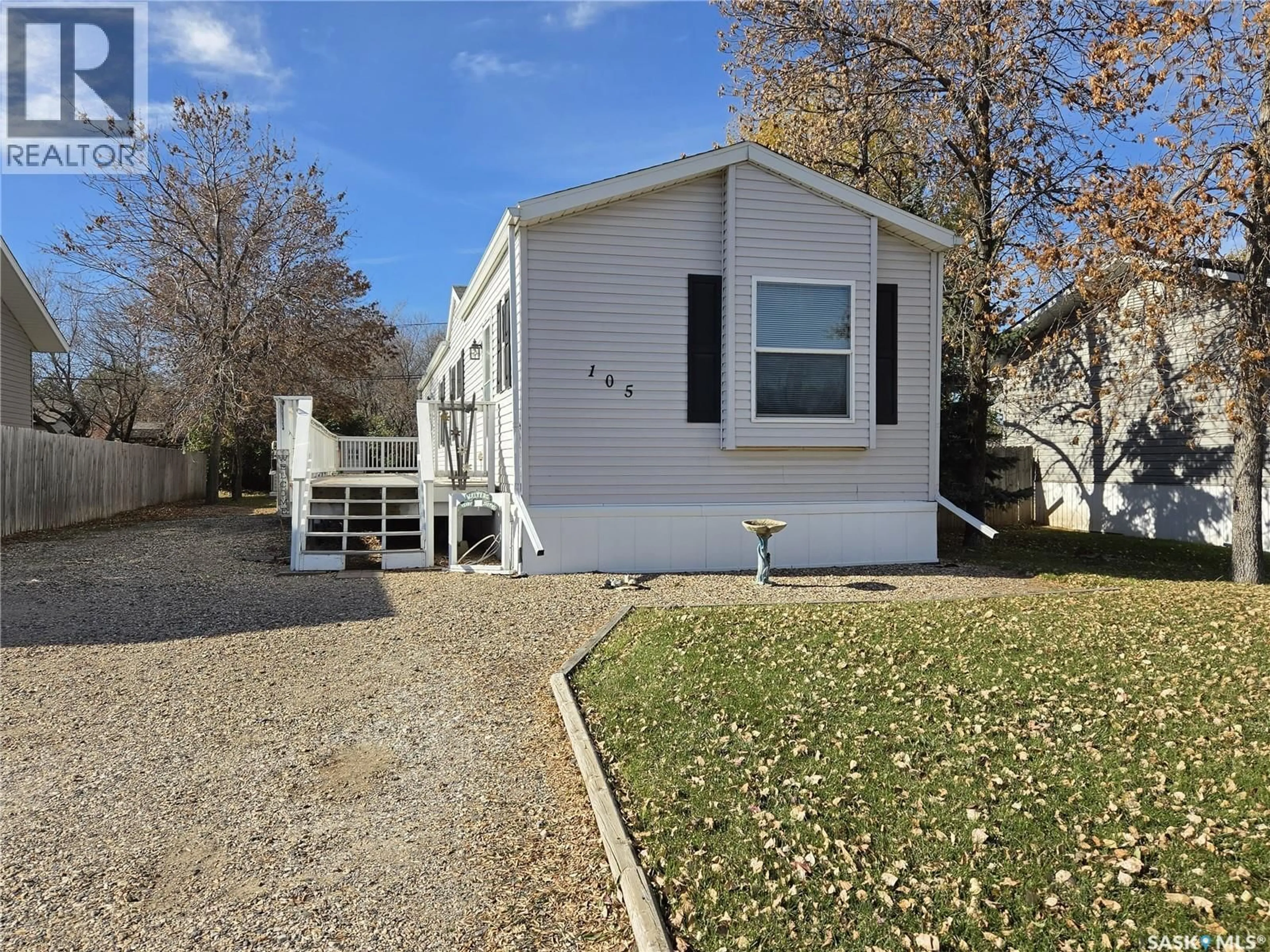 Home with vinyl exterior material, street for 105 GROVE STREET, Lampman Saskatchewan S0C1N0