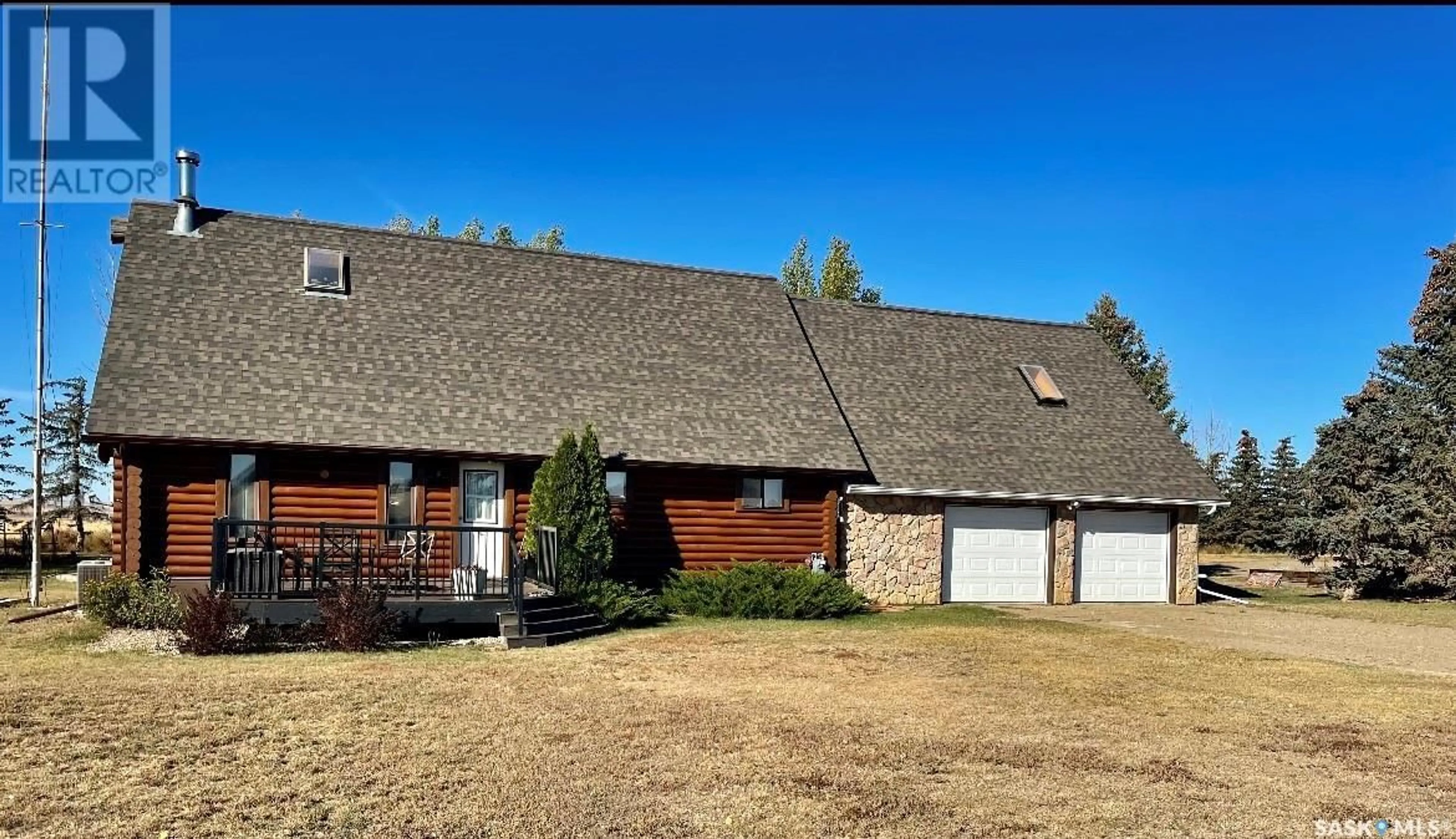 Home with brick exterior material for Log House Acreage, Loreburn Rm No. 254 Saskatchewan S0H2S0