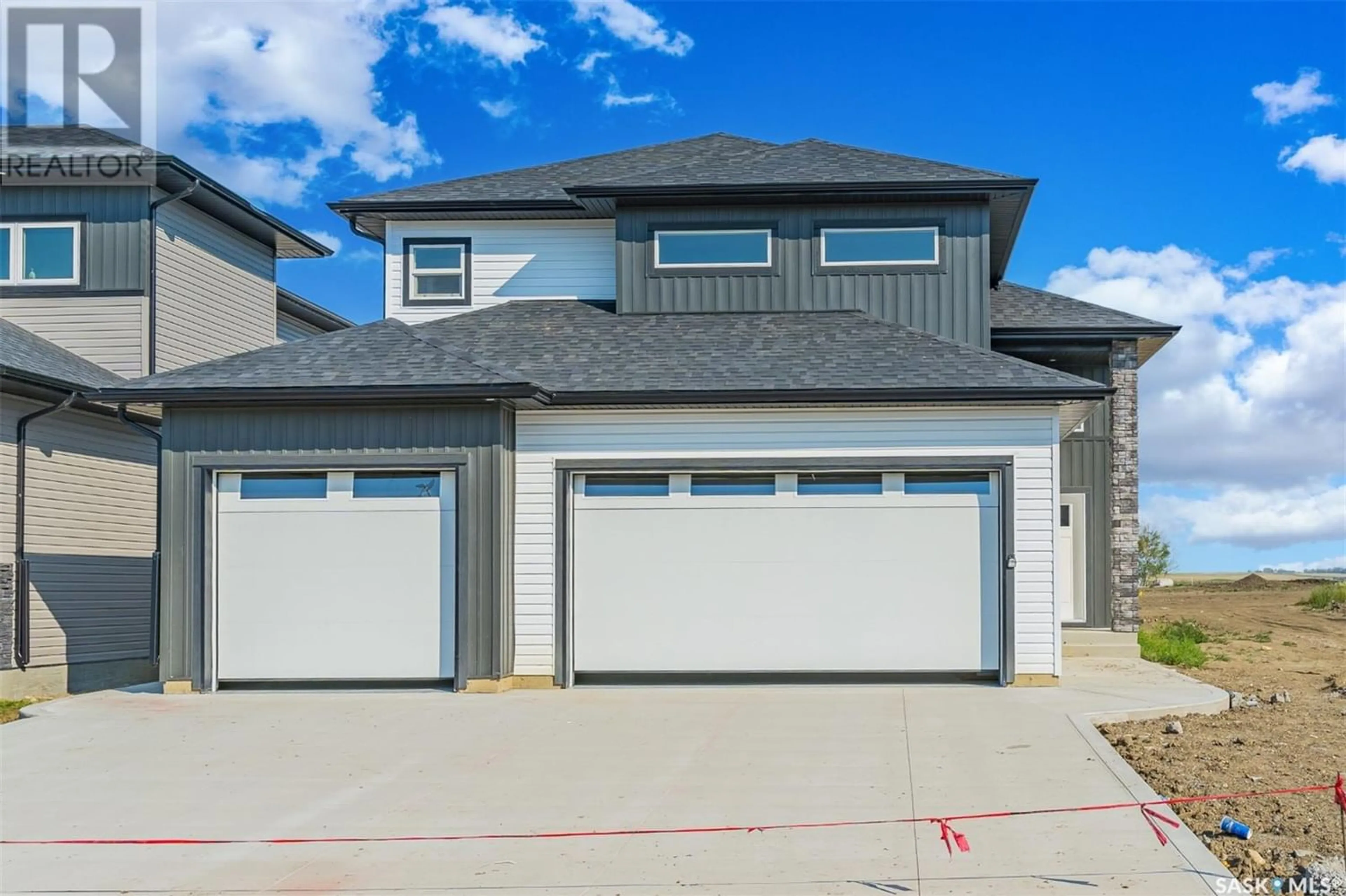 Frontside or backside of a home for 580 Kalra STREET, Saskatoon Saskatchewan S7W1E5